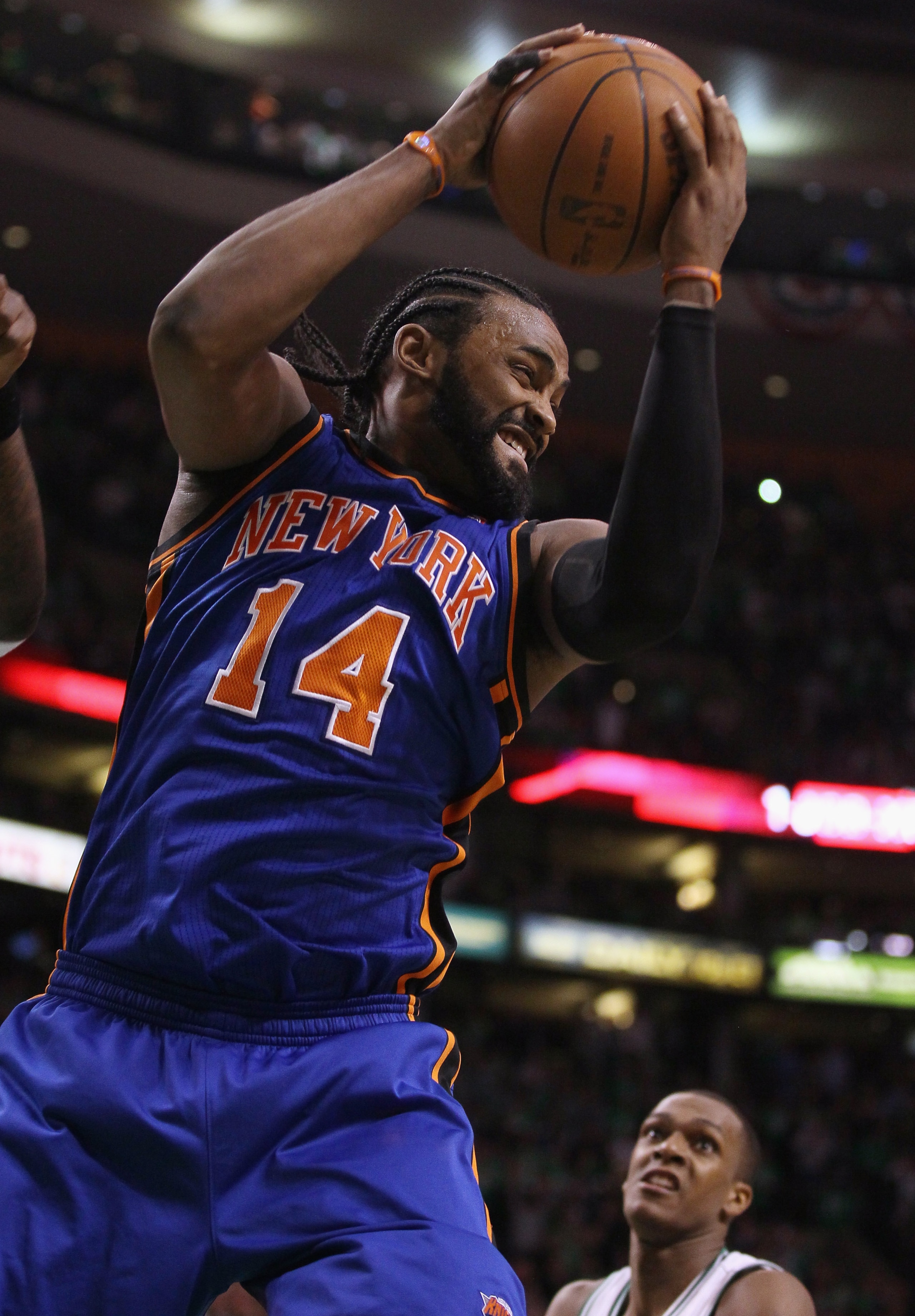 BOSTON, MA - APRIL 17:  Ronny Turiaf #14 of the New York Knicks grabs the rebound as Rajon Rondo #9 of the Boston Celtics defends in Game One of the Eastern Conference Quarterfinals in the 2011 NBA Playoffs on April 17, 2011 at the TD Garden in Boston, Ma
