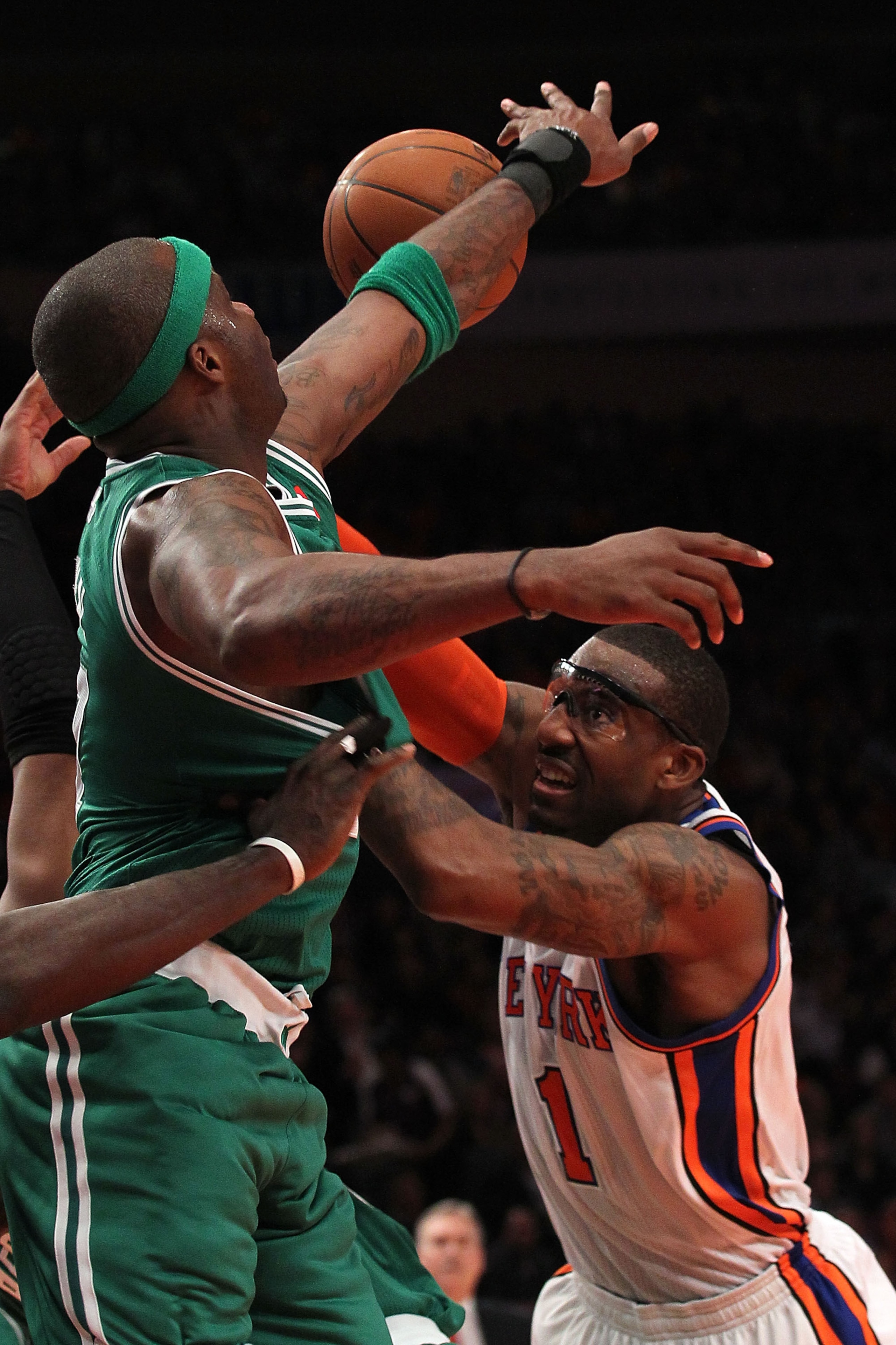 NEW YORK, NY - APRIL 22:  Amar'e Stoudemire #1 of the New York Knicks loses the ball as he drives against Jermaine O'Neal #7 of the Boston Celtics in Game Three of the Eastern Conference Quarterfinals in the 2011 NBA Playoffs on April 22, 2011 at Madison