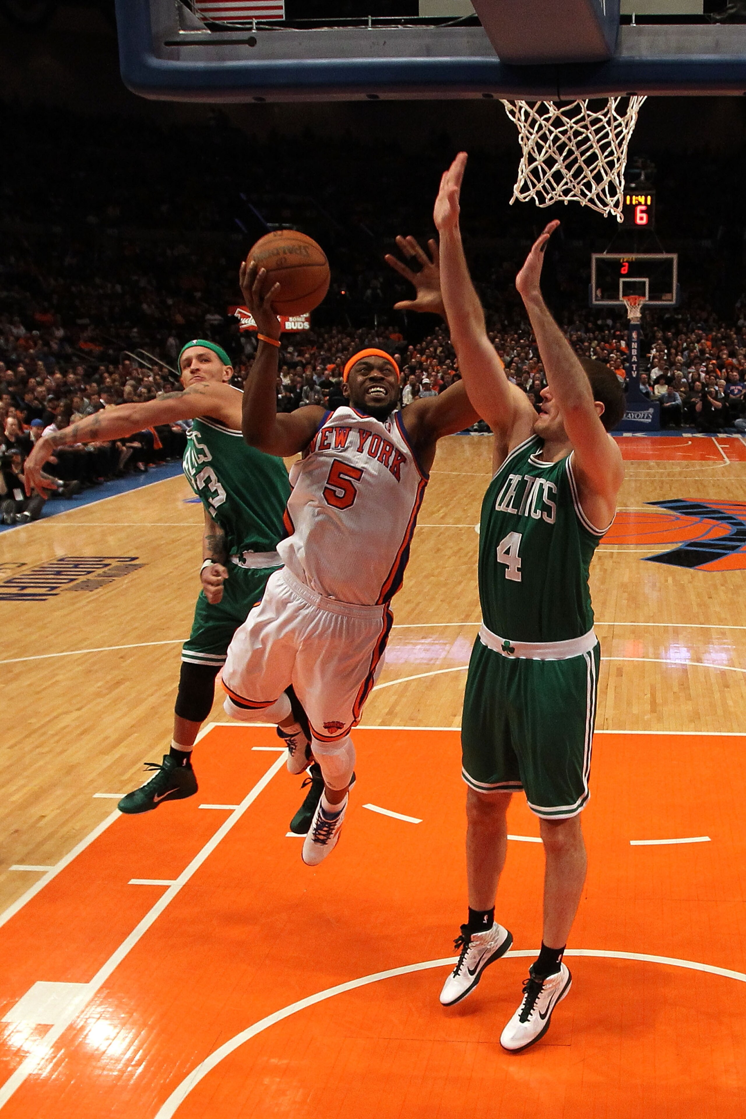 NEW YORK, NY - APRIL 22:  Bill Walker #5 of the New York Knicks drives for a shot attempt against Delonte West #13 and Nenad Krstic #4 of the Boston Celtics in Game Three of the Eastern Conference Quarterfinals in the 2011 NBA Playoffs on April 22, 2011 a