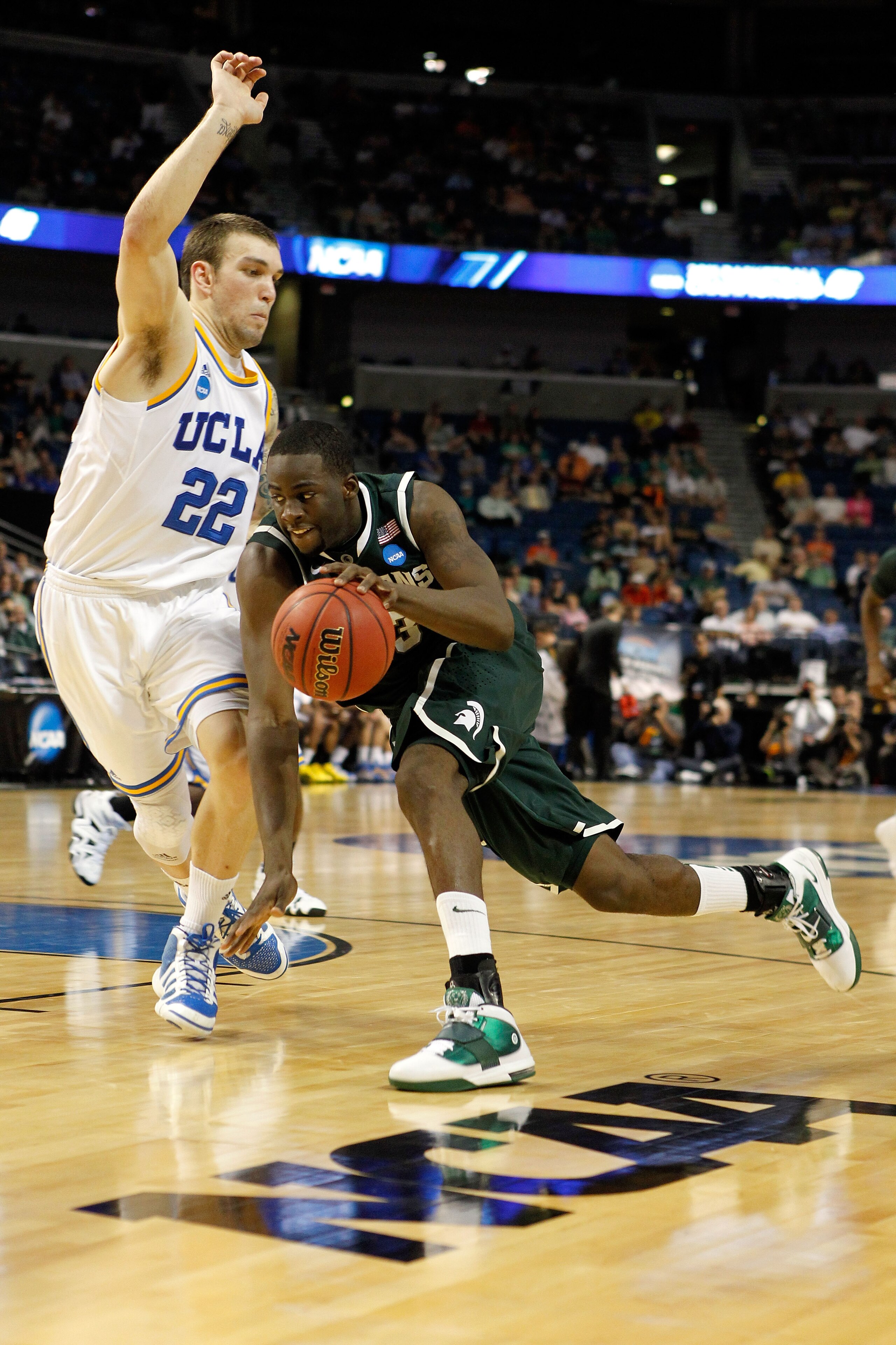 TAMPA, FL - MARCH 17:  Draymond Green #23 of the Michigan State Spartans drives against Reeves Nelson #22 of the UCLA Bruins during the second round of the 2011 NCAA men's basketball tournament at St. Pete Times Forum on March 17, 2011 in Tampa, Florida.