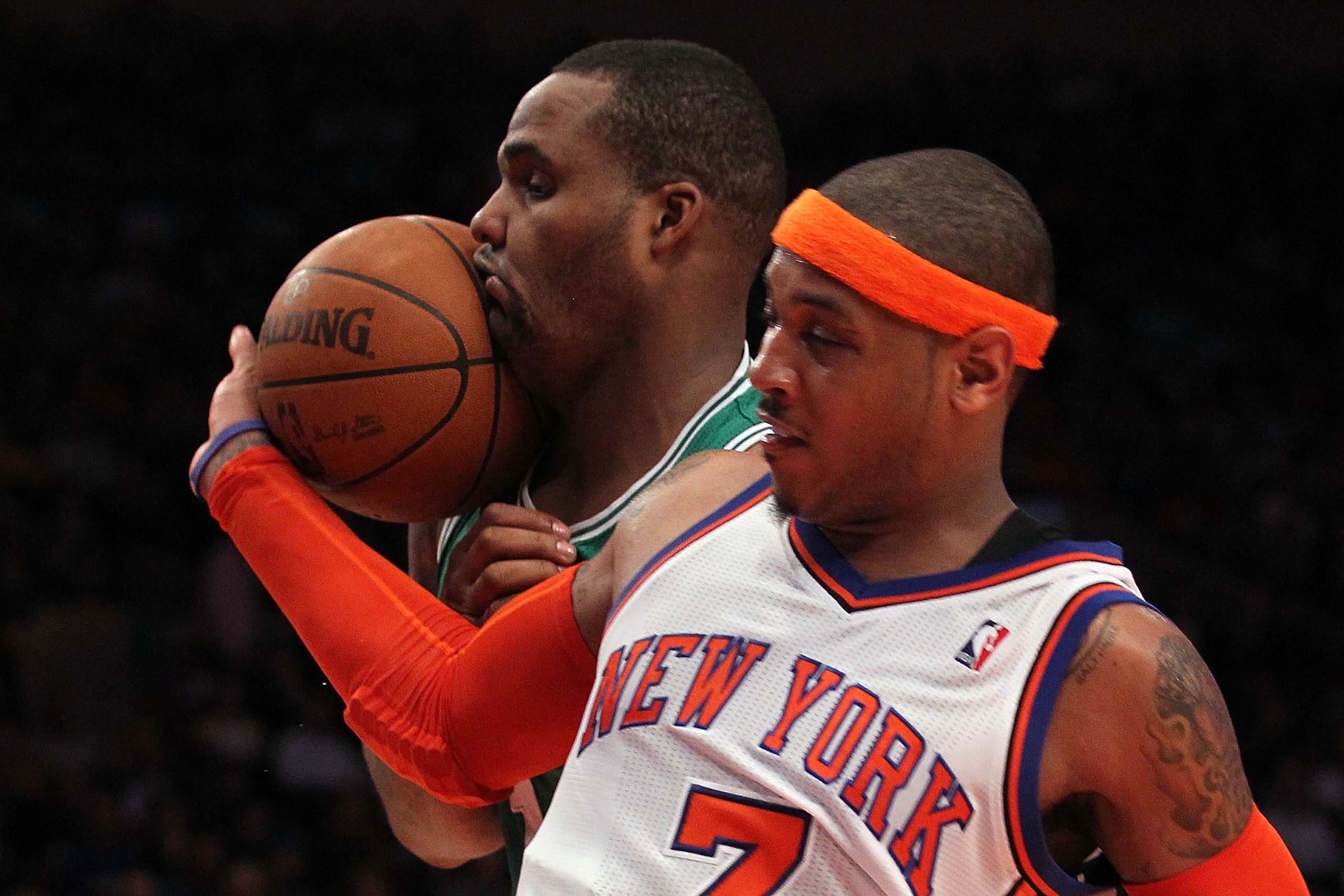 NEW YORK, NY - APRIL 22:  Carmelo Anthony #7 of the New York Knicks and Glen Davis #11 of the Boston Celtics fight for control of the ball in the first half of Game Three of the Eastern Conference Quarterfinals in the 2011 NBA Playoffs on April 22, 2011 a