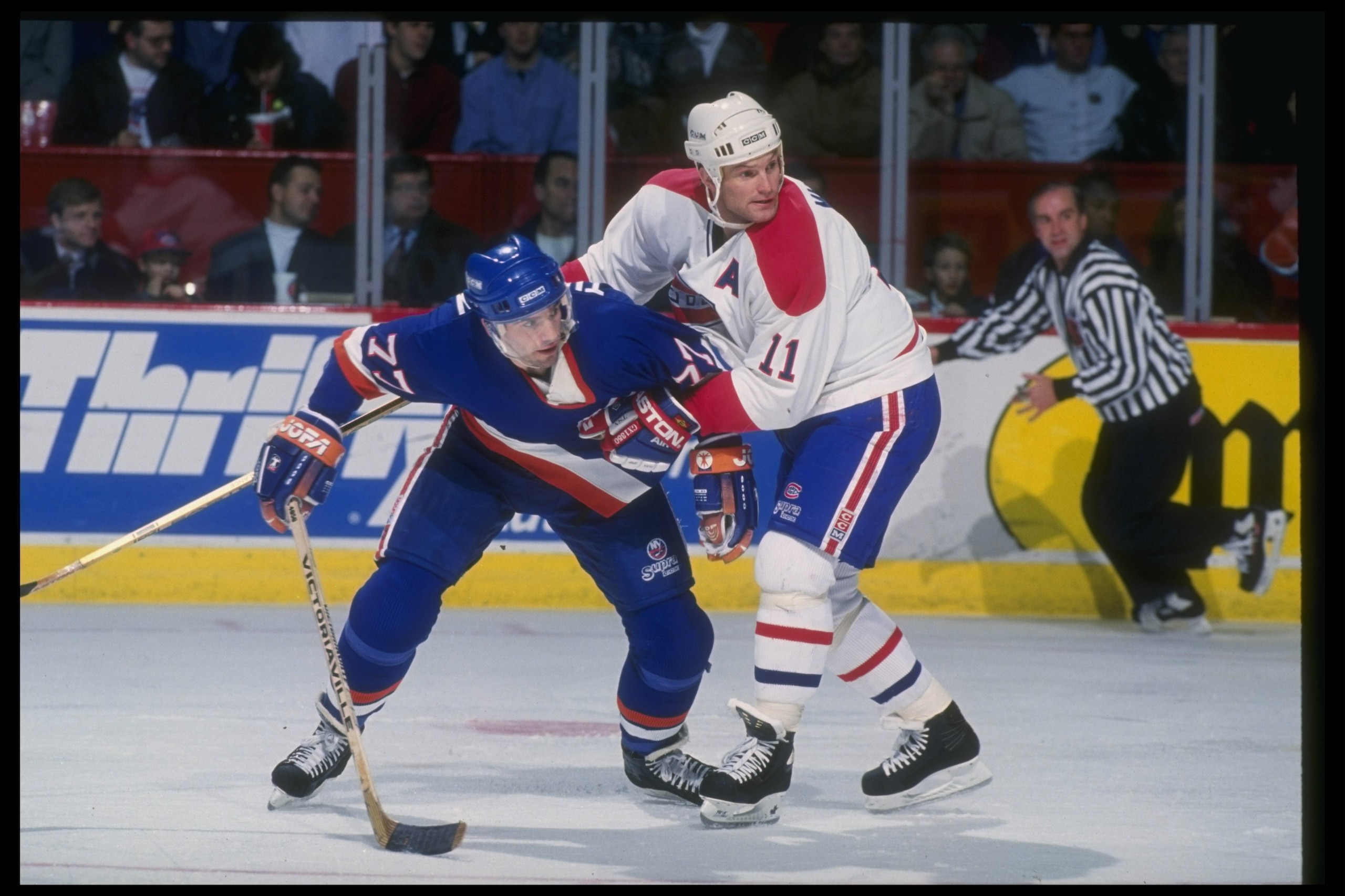 22 Dec 1993:  Defenseman Kirk Muller of the Montreal Canadiens and center Pierre Turgeon of the New York Islanders fight during a game at the Montreal Forum in Montreal, Quebec. Mandatory Credit: Robert Laberge  /Allsport