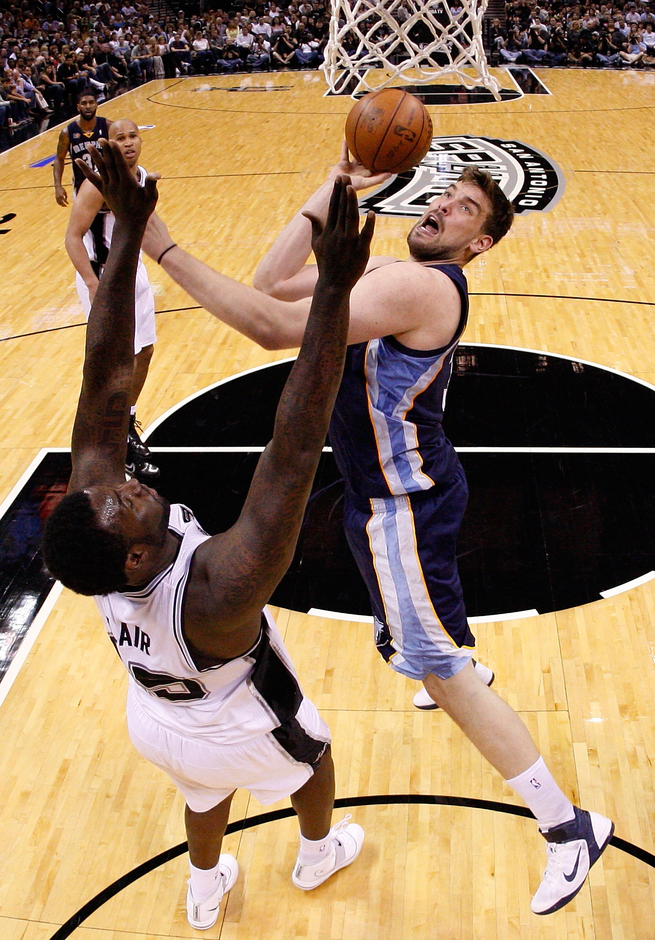 SAN ANTONIO, TX - APRIL 17:  Center Marc Gasol #33 of the Memphis Grizzlies takes a shot against DeJuan Blair #45 of the San Antonio Spurs in Game One of the Western Conference Quarterfinals in the 2011 NBA Playoffs on April 17, 2011 at AT&T Center in San