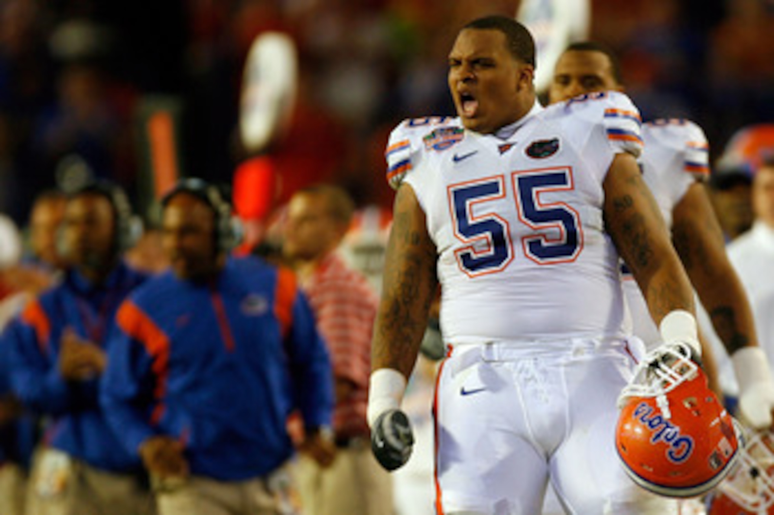 MIAMI - JANUARY 08: Mike Pouncey #55 of the Florida Gators reacts after a play against the Oklahoma Sooners in the FedEx BCS National Championship Game at Dolphin Stadium on January 8, 2009 in Miami, Florida. (Photo by Eliot J. Schechter/Getty Images) MIAMI - JANUARY 08: Mike Pouncey #55 of the Florida Gators reacts after a play against the Oklahoma Sooners in the FedEx BCS National Championship Game at Dolphin Stadium on January 8, 2009 in Miami, Florida. (Photo by Eliot J. Schechter/Getty Images)