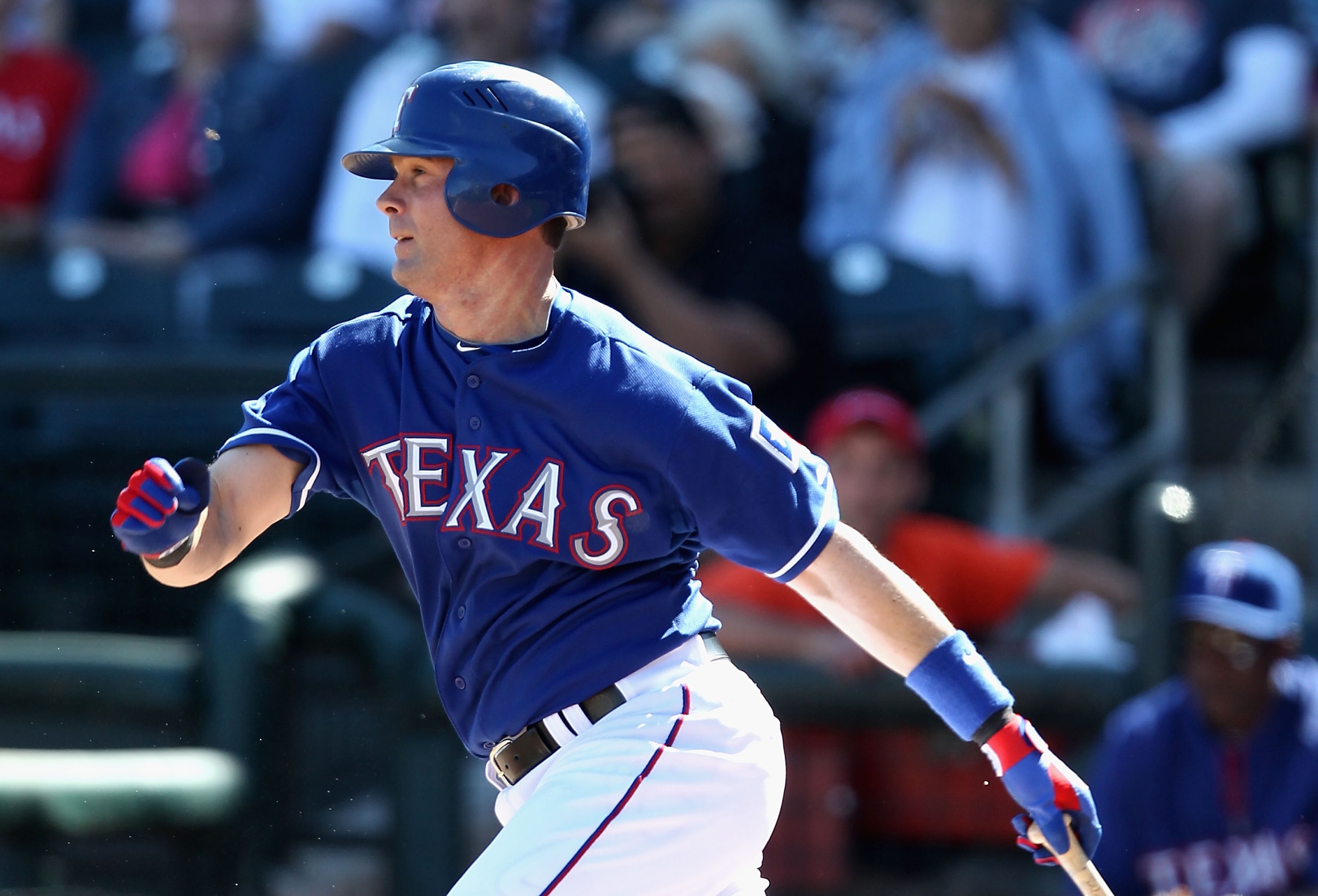 SURPRISE, AZ - MARCH 02:  Michael Young #10 of the Texas Rangers hits a single against the Los Angeles Angels of Anaheim during the second inning of the spring training game at Surprise Stadium on March 2, 2011 in Surprise, Arizona.  (Photo by Christian P