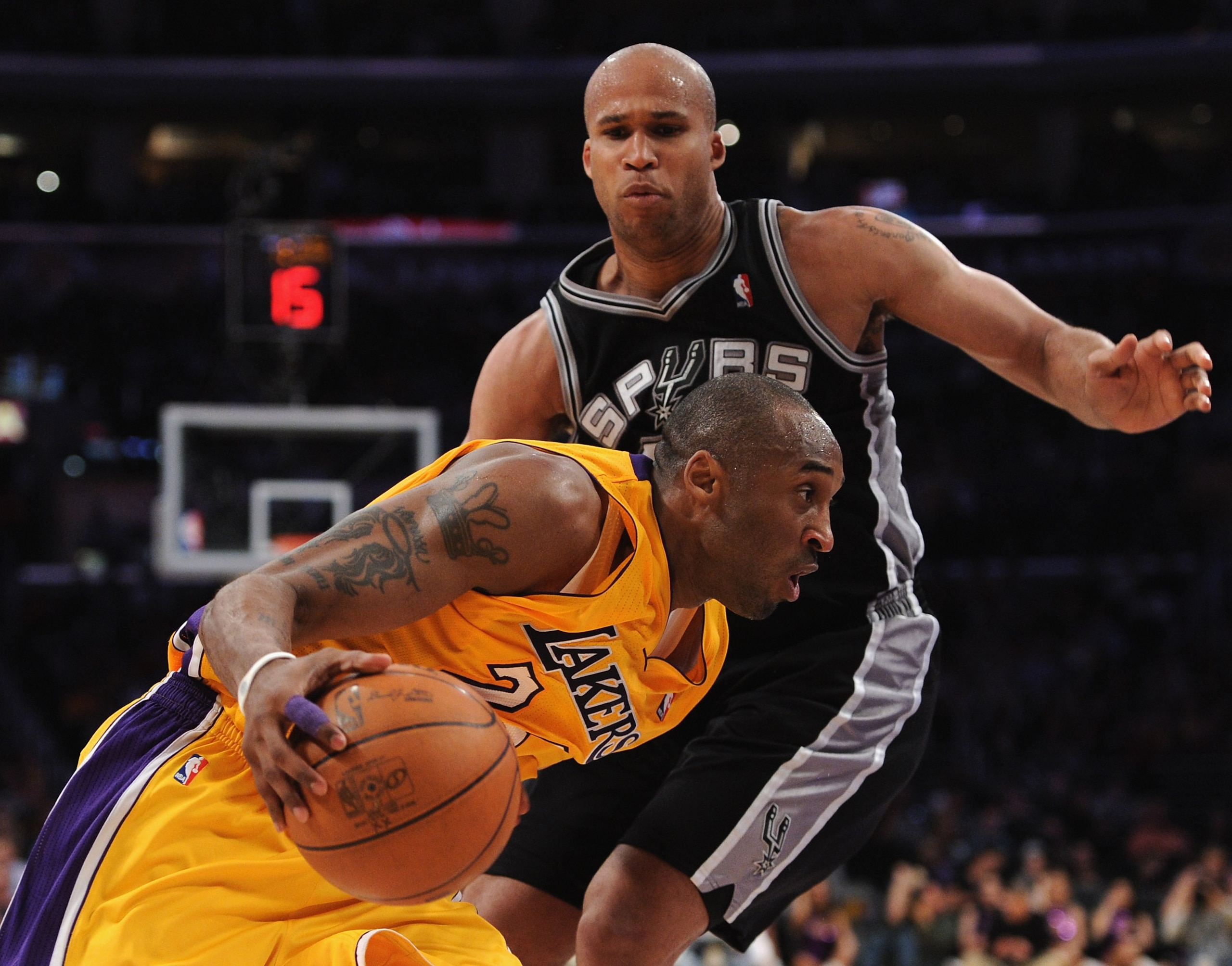LOS ANGELES, CA - APRIL 12:  Kobe Bryant #24 of the Los Angeles Lakers drives on Richard Jefferson #24 of the San Antonio Spurs at Staples Center on April 12, 2011 in Los Angeles, California.  NOTE TO USER: User expressly acknowledges and agrees that, by