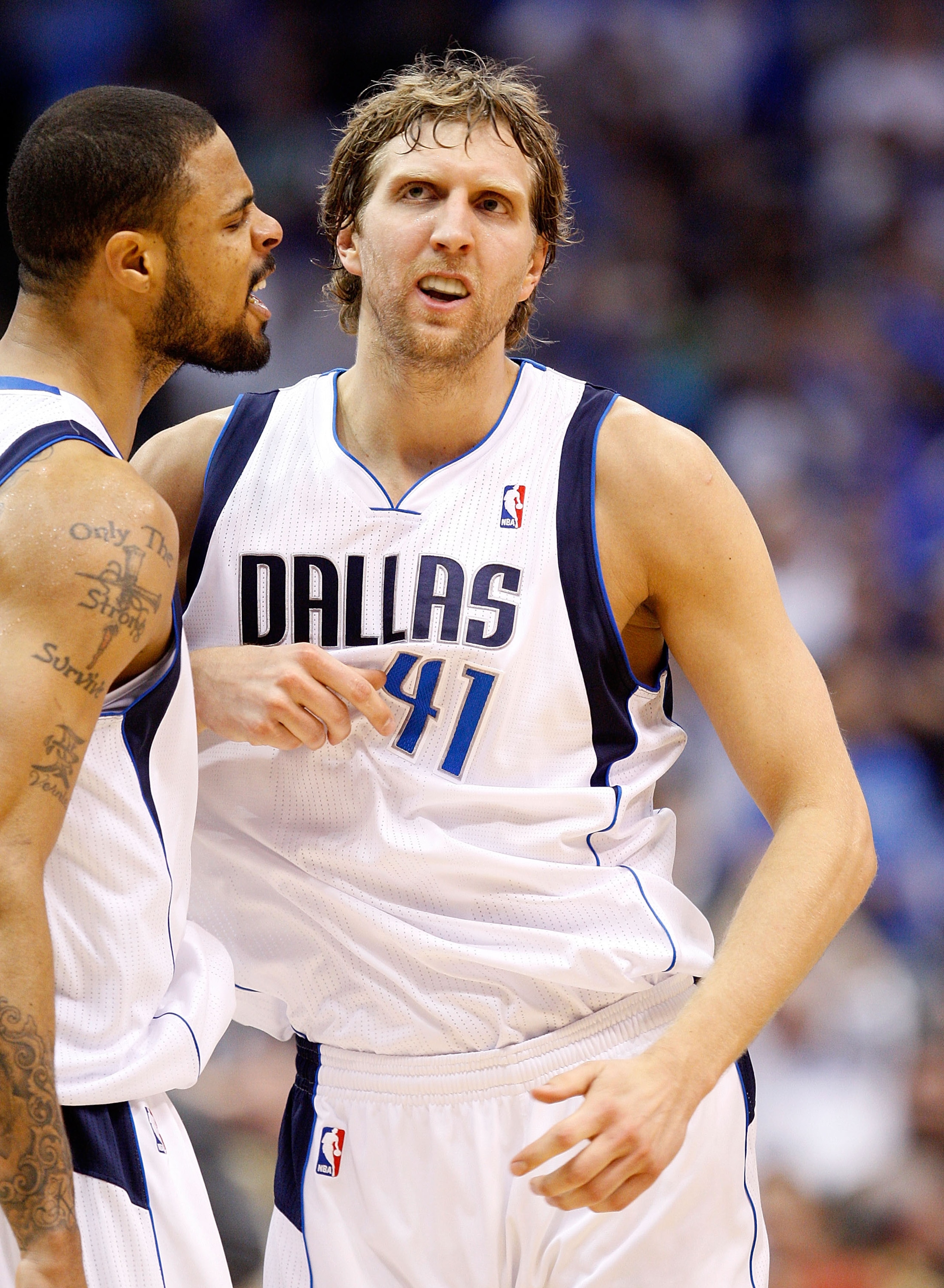 DALLAS, TX - APRIL 19:  Forward Dirk Nowitzki #41 of the Dallas Mavericks reacts with Tyson Chandler #6 against the Portland Trail Blazers in Game Two of the Western Conference Quarterfinals during the 2011 NBA Playoffs on April 19, 2011 at American Airli