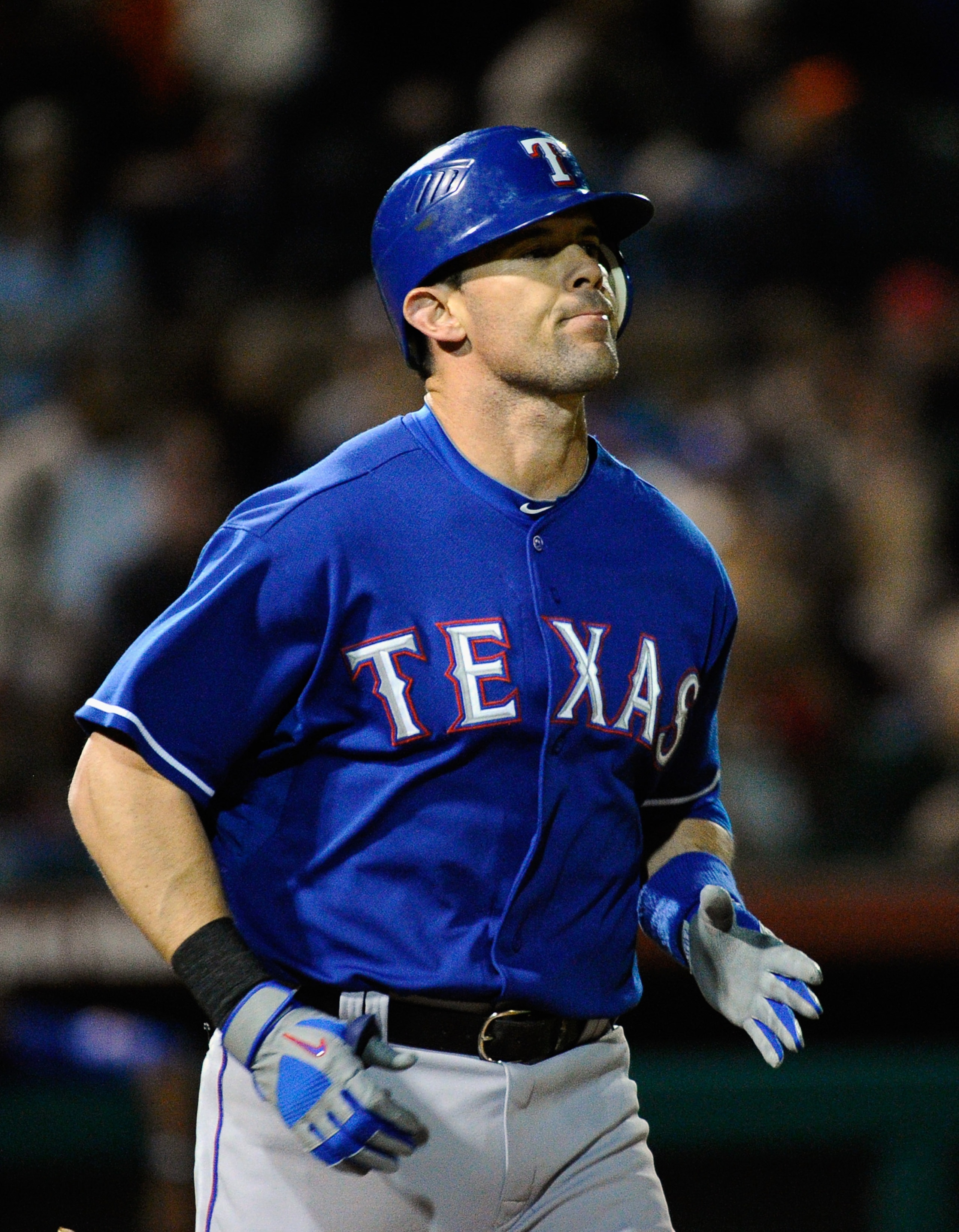 SCOTTSDALE, AZ - MARCH 07:   Michael Young #10 of the Texas Rangers runs to first base against the San Francisco Giants during an exhibition baseball game in the first meeting between the two teams since the World Series during the spring training game at