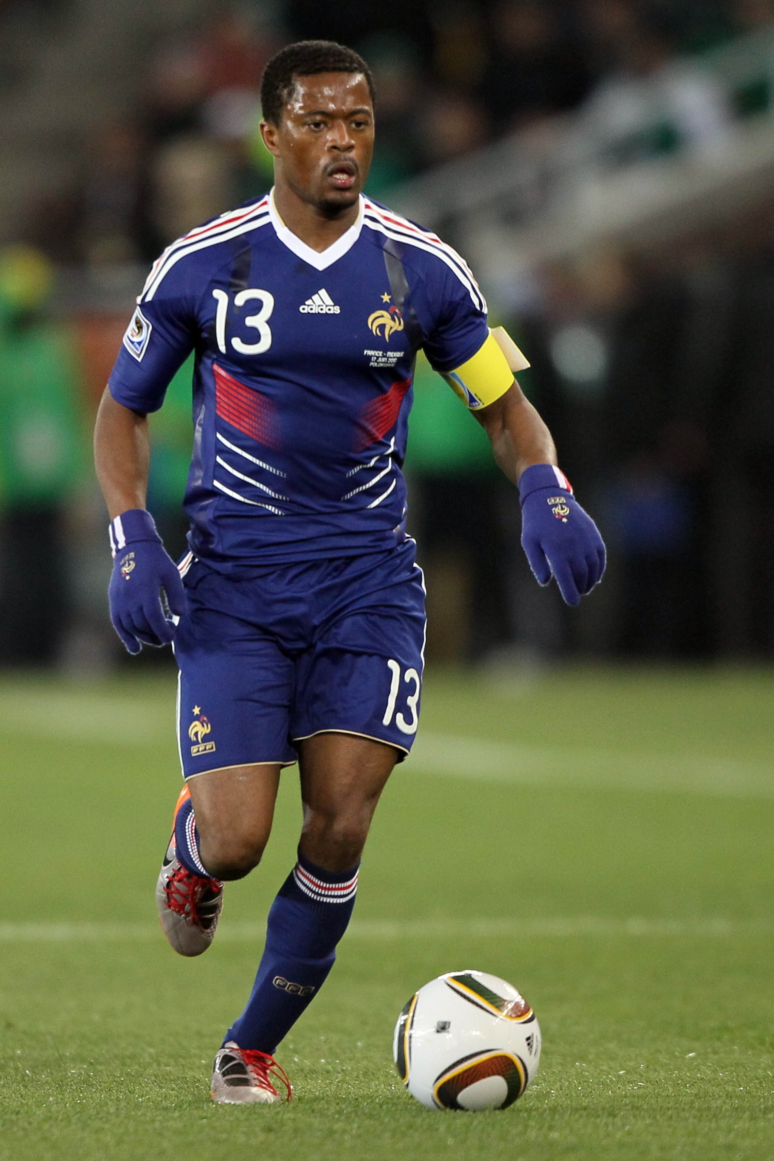 POLOKWANE, SOUTH AFRICA - JUNE 17:  Patrice Evra of France runs with the ball during the 2010 FIFA World Cup South Africa Group A match between France and Mexico at the Peter Mokaba Stadium on June 17, 2010 in Polokwane, South Africa.  (Photo by Christof