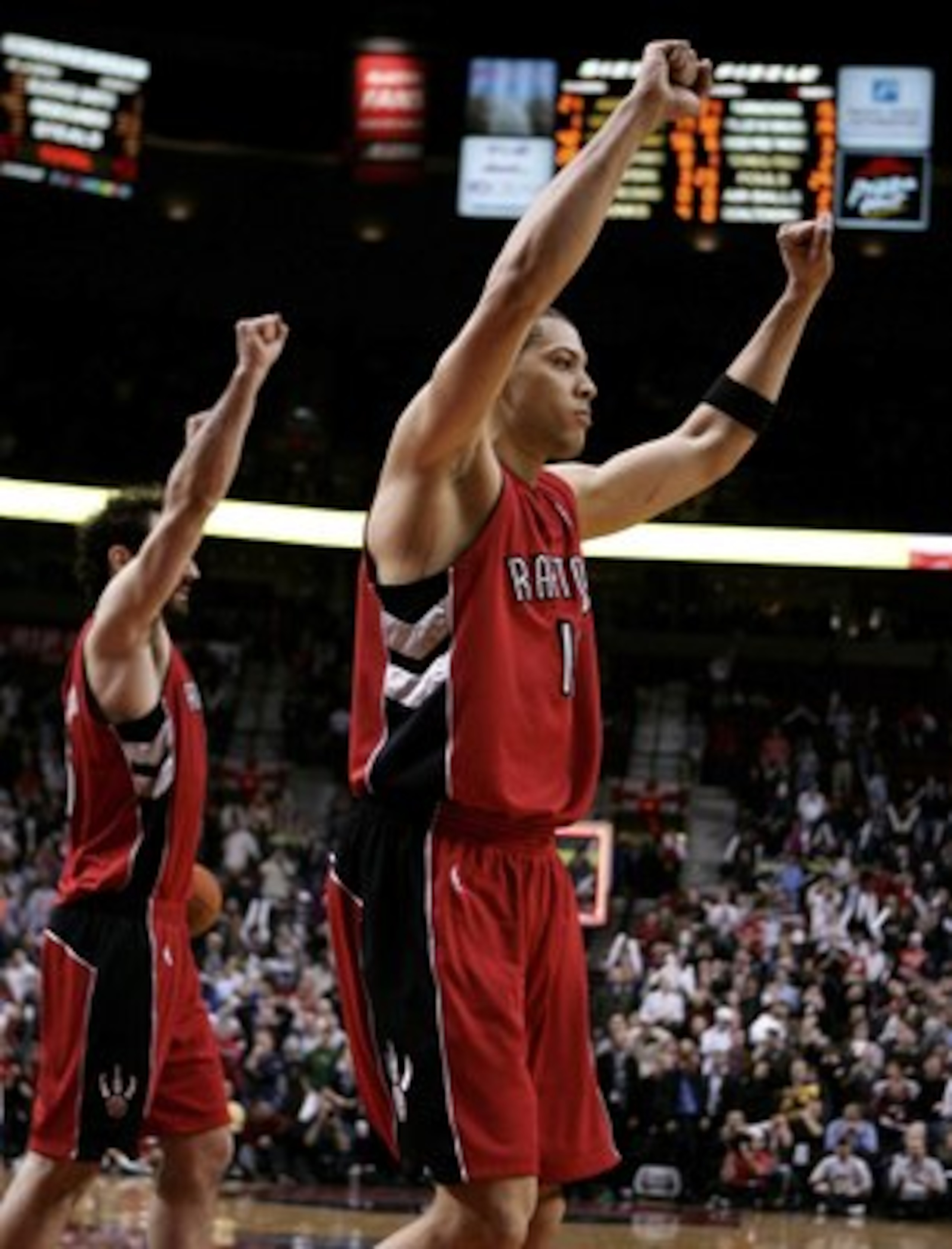 PORTLAND, OR - DECEMBER 22:   Anthony Parker #18 of the Toronto Raptors celebrates a 101-100 overtime victory over the Portland Trail Blazers on December 22, 2006 at the Rose Garden Arena in Portland, Oregon.  NOTE TO USER: User expressly acknowledges and
