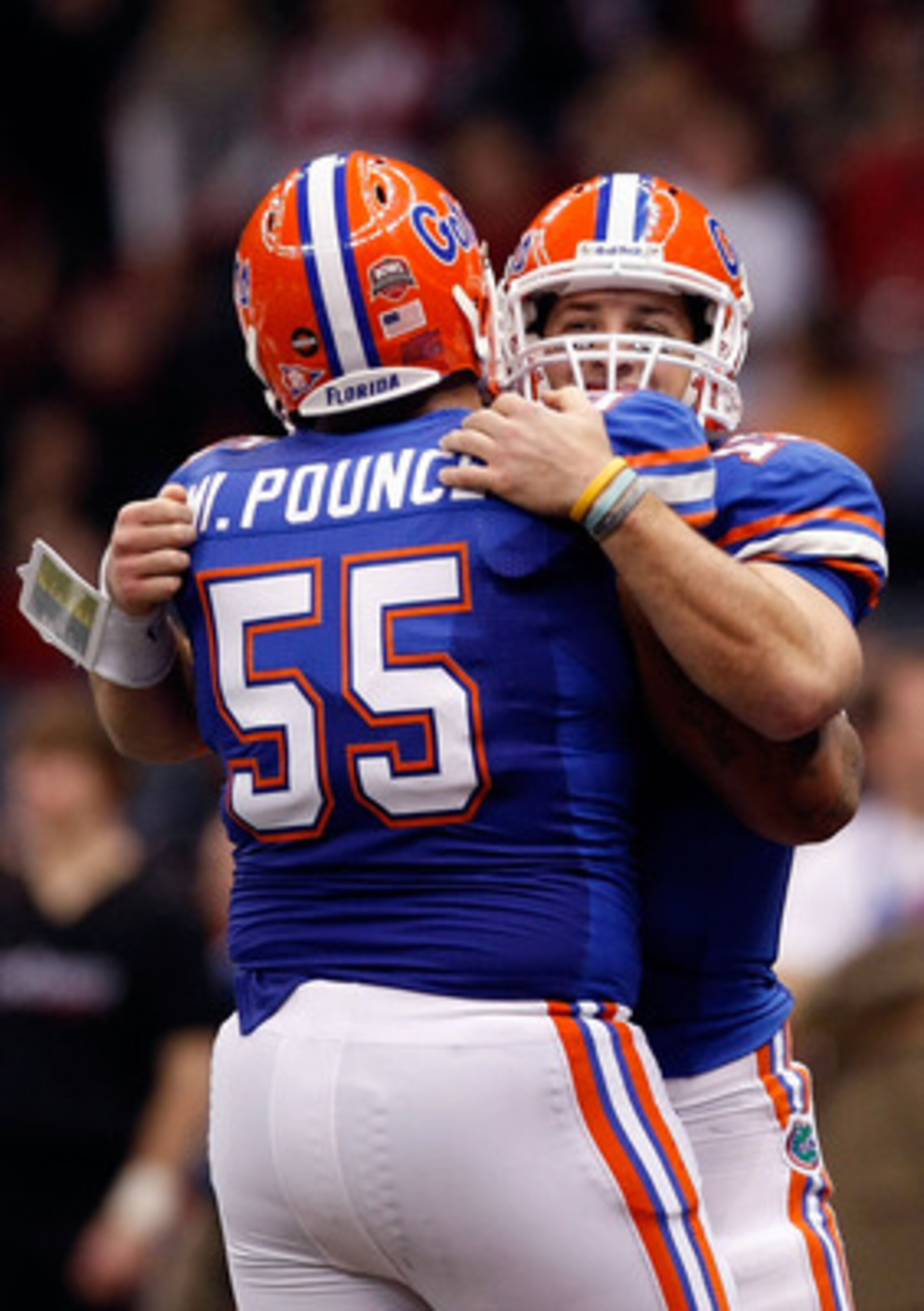 NEW ORLEANS - JANUARY 01: Tim Tebow #15 of the Florida Gators hugs teammate Mike Pouncey #55 after scoring a touchdown against the Cincinnati Bearcats during the Allstate Sugar Bowl at the Louisana Superdome on January 1, 2010 in New Orleans, Louisiana. NEW ORLEANS - JANUARY 01: Tim Tebow #15 of the Florida Gators hugs teammate Mike Pouncey #55 after scoring a touchdown against the Cincinnati Bearcats during the Allstate Sugar Bowl at the Louisana Superdome on January 1, 2010 in New Orleans, Louisiana.