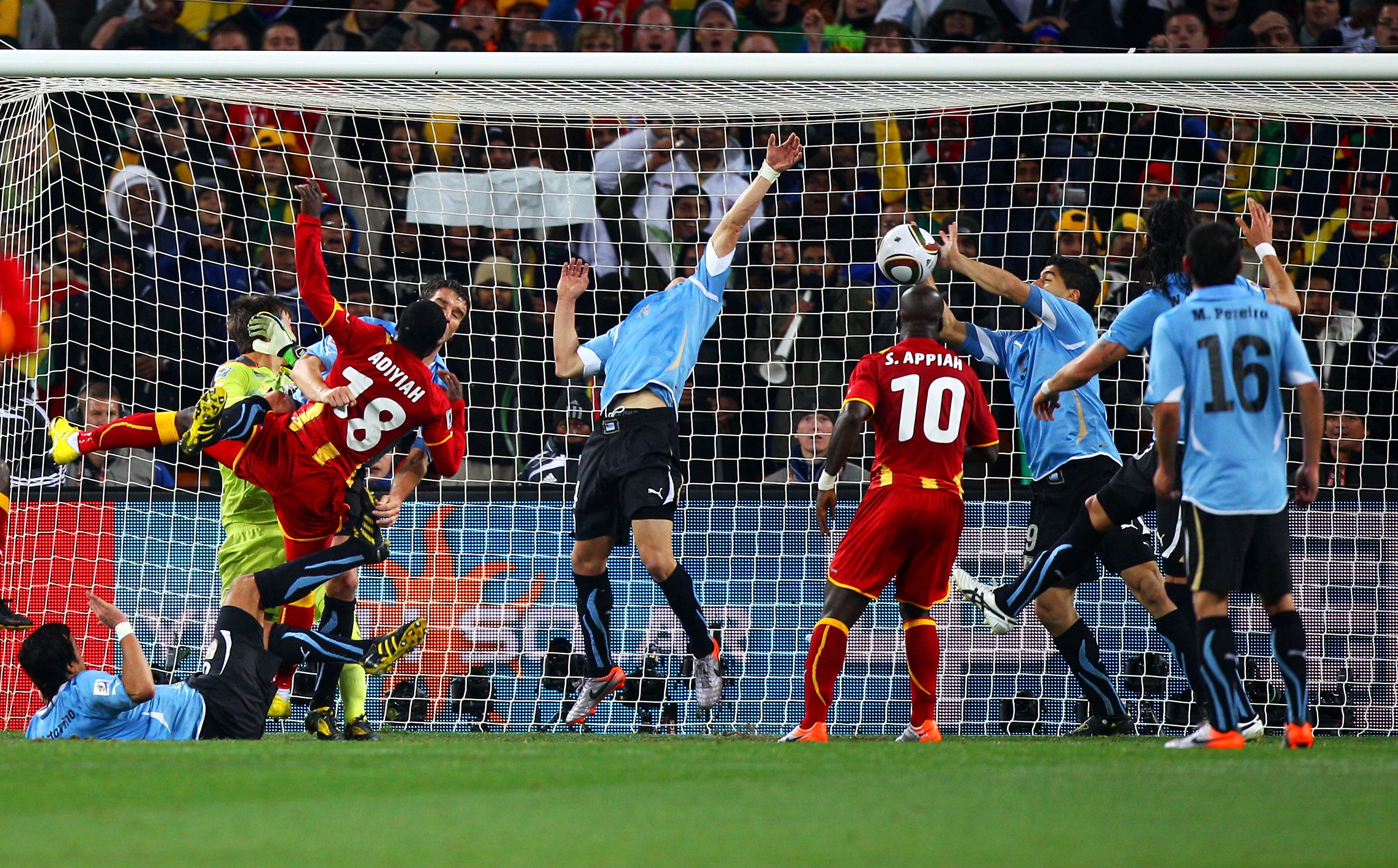 JOHANNESBURG, SOUTH AFRICA - JULY 02:  Luis Suarez of Uruguay handles the ball on the goal line, for which he is sent off, during the 2010 FIFA World Cup South Africa Quarter Final match between Uruguay and Ghana at the Soccer City stadium on July 2, 2010