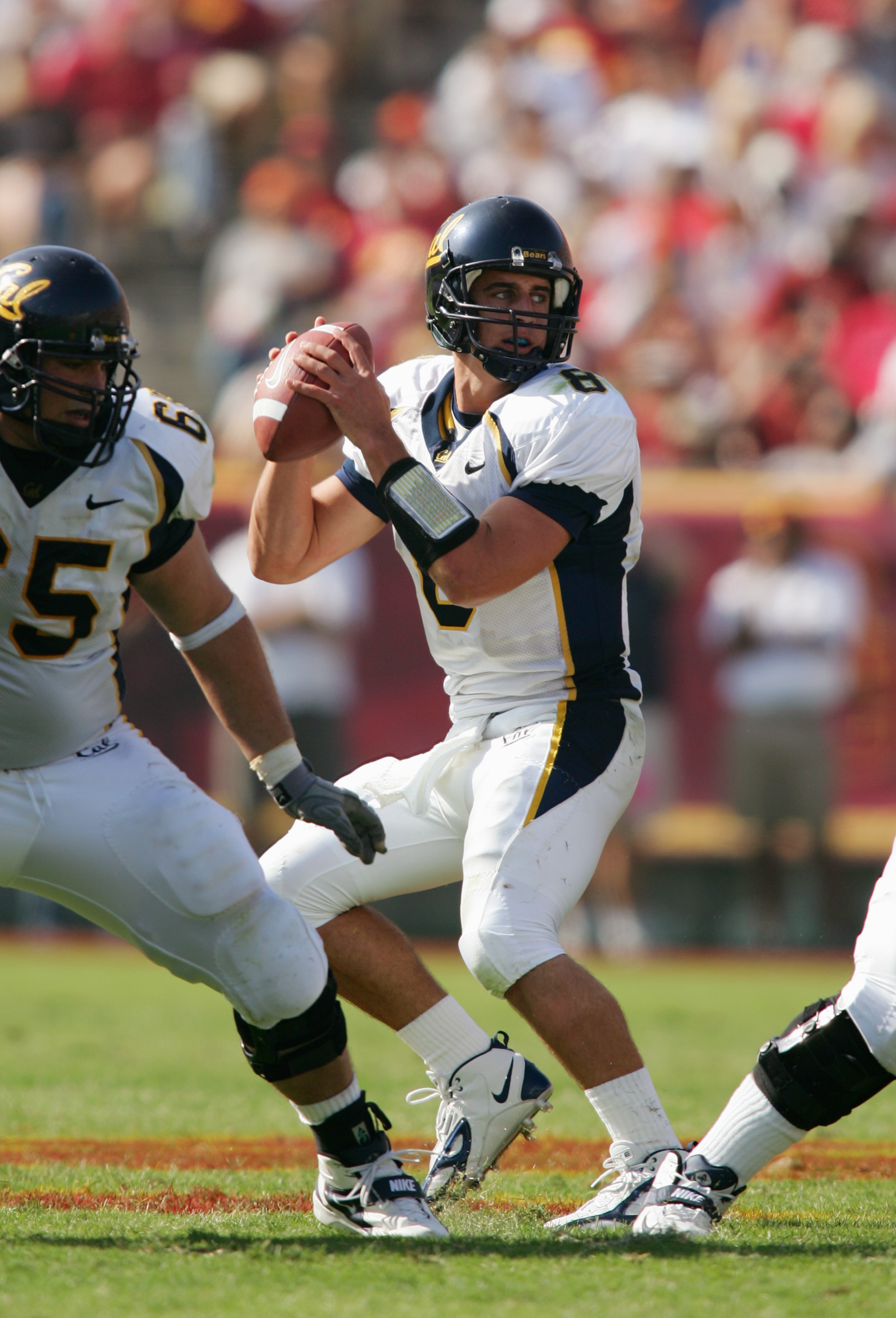 LOS ANGELES - OCTOBER 9:  Aaron Rodgers #8 of the California Golden Bears drops back to pass during the game against the USC Trojans on October 9, 2004 at Los Angeles Memorial Coliseum in Los Angeles, California.  The Trojans defeated the Golden Bears 23-