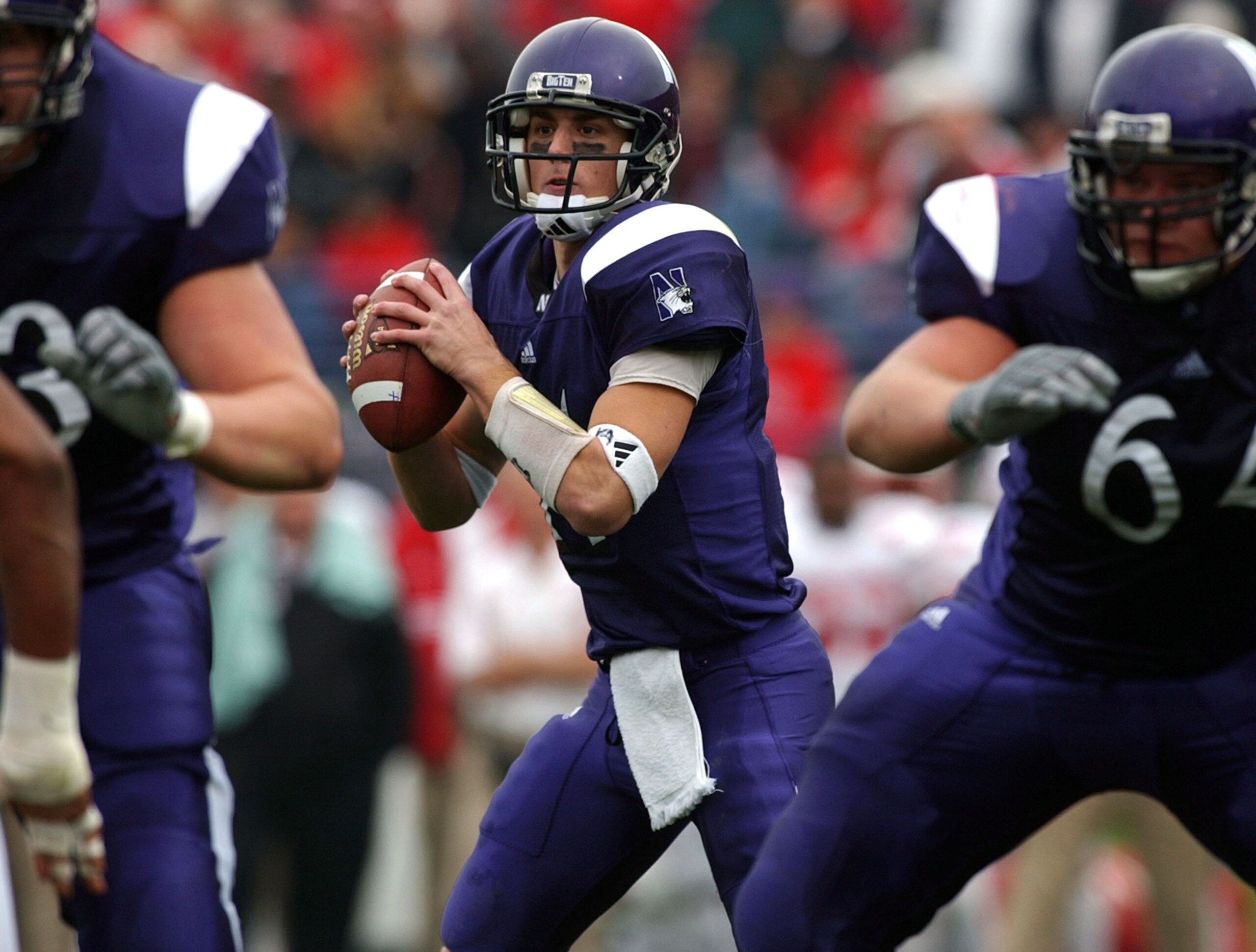 EVANSTON, IL - OCTOBER 25:  Quarterback Brett Basanez #14 of Northwestern looks downfield for a receiver against Wisconsin on October 25, 2003 at Ryan Field at Northwestern University in Evanston, Illinois. Northwestern defeated Wisconsin 16-7.  (Photo by