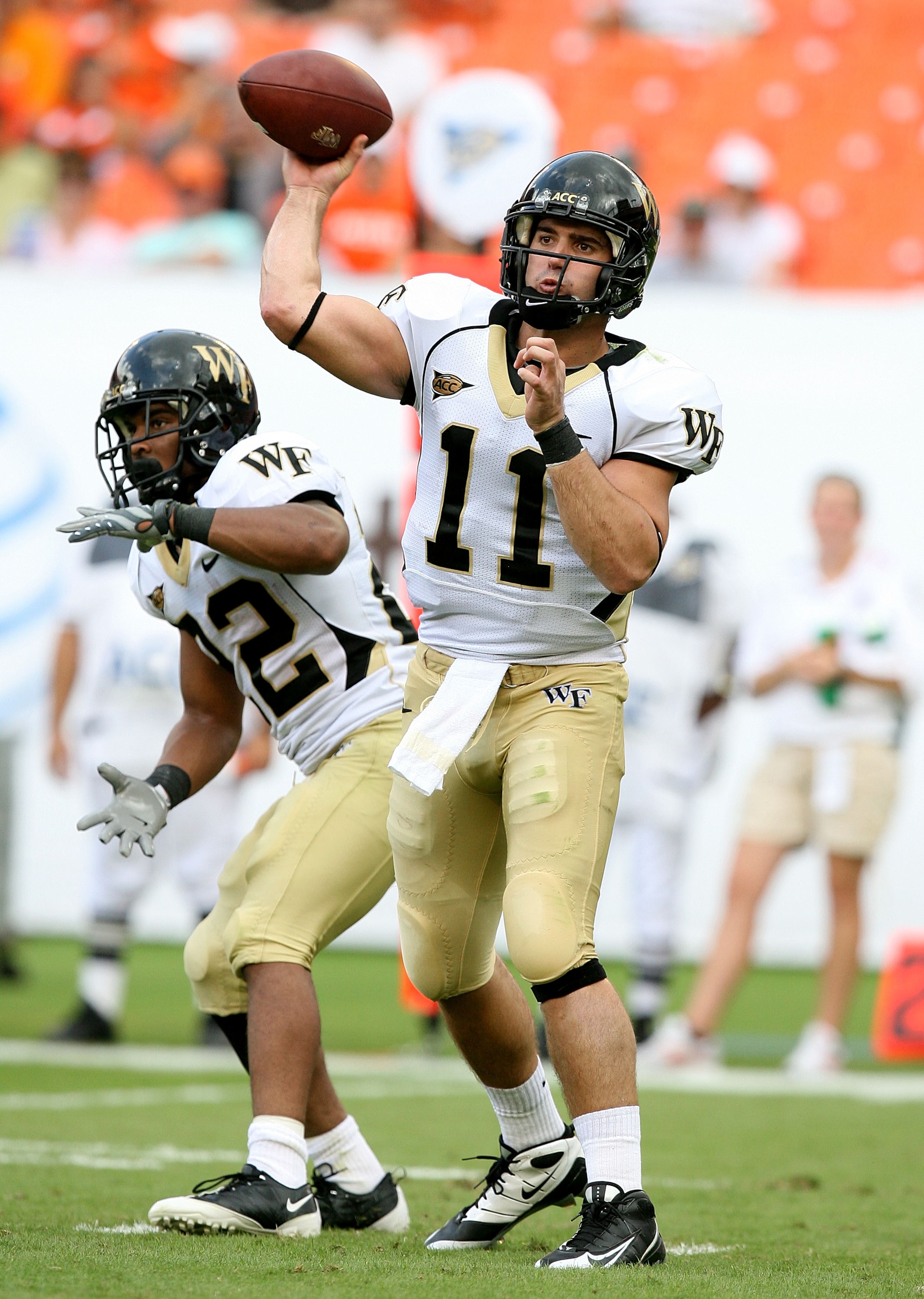MIAMI - OCTOBER 25:  Quarterback Riley Skinner #11 of the Wake Forest Demon Decons throws a pass against the Miami Hurricanes at Dolphin Stadium on October 25, 2008 in Miami, Florida.  (Photo by Doug Benc/Getty Images)