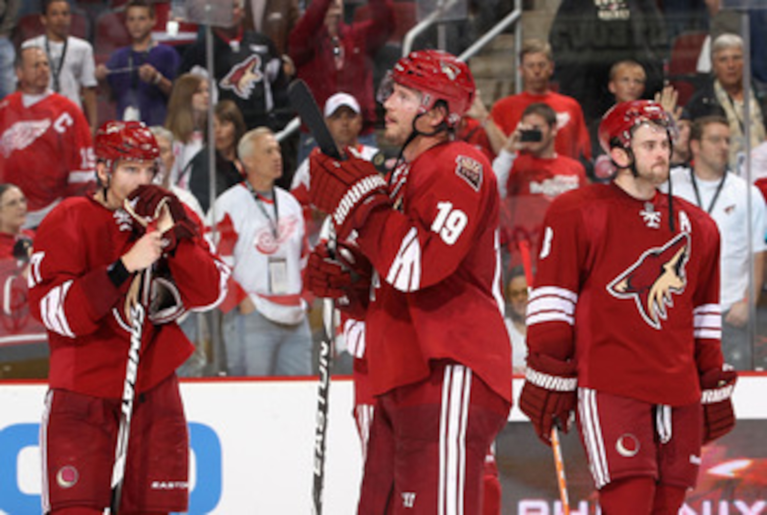 GLENDALE, AZ - APRIL 20:  (L-R) Radim Vrbata #17, Shane Doan #19 and Keith Yandle #3 of the Phoenix Coyotes react after being defeated by the Detroit Red Wings in Game Four of the Western Conference Quarterfinals during the 2011 NHL Stanley Cup Playoffs a