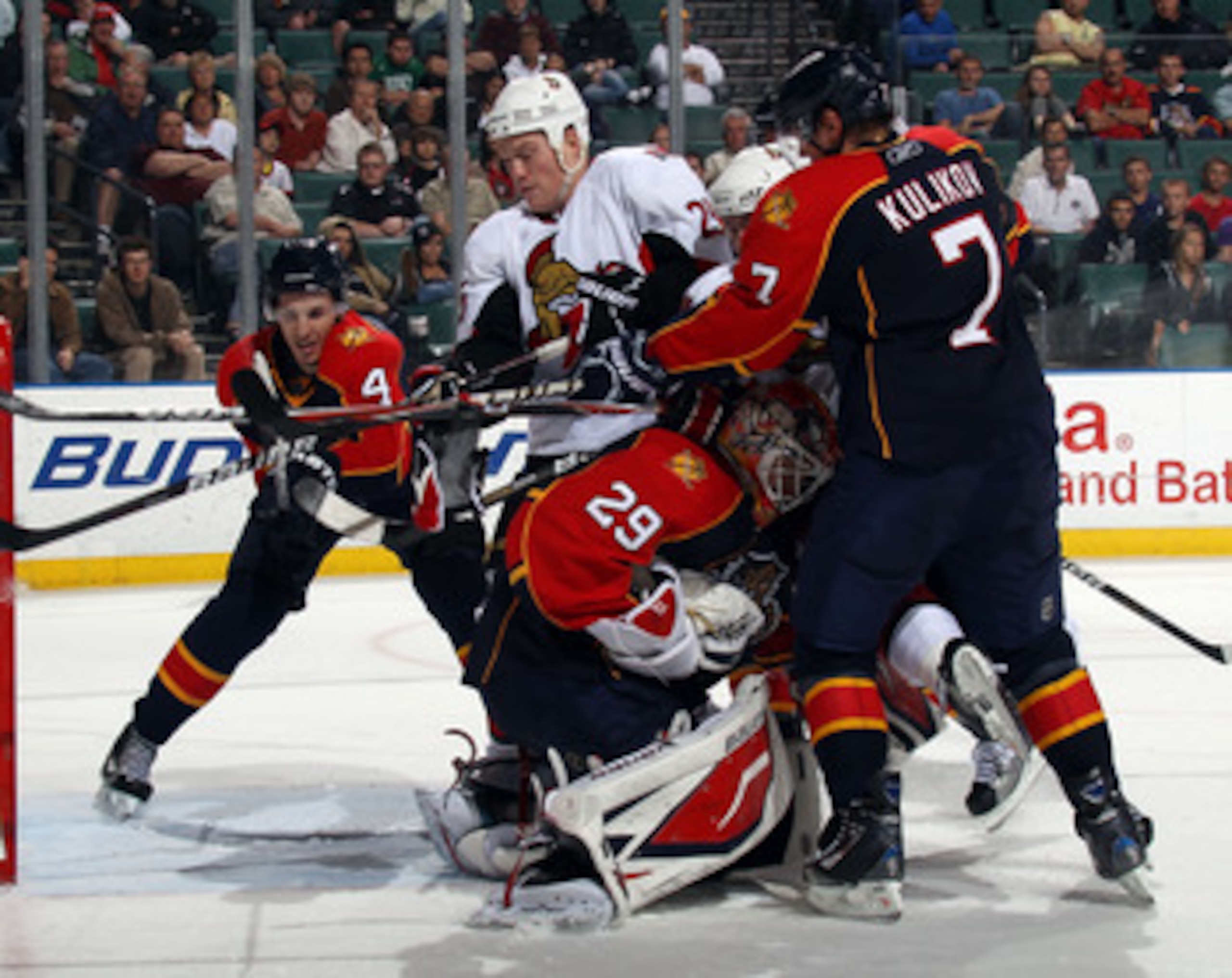 SUNRISE, FL - MARCH 10: Keaton Ellerby #4, Dmitry Kulikov #7 and Tomas Vokoun #29 of the Florida Panthers defend the net against Chris Neil #25 of the Ottawa Senators at the BankAtlantic Center on March 10, 2011 in Sunrise, Florida. The Senators defeated