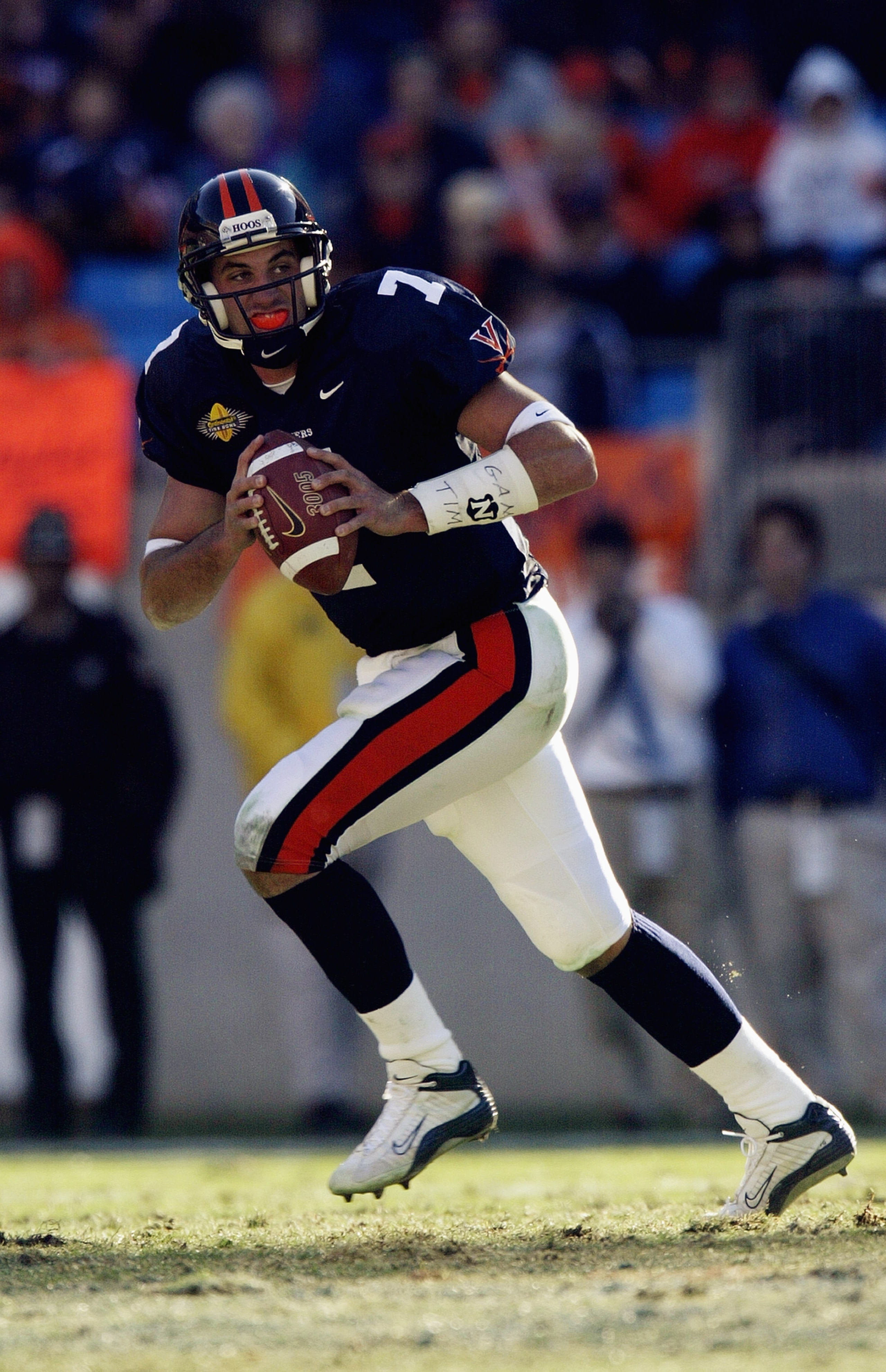 CHARLOTTE, NC - DECEMBER 27:  Quarterback Matt Schaub #7 of the Pittsburgh Panthers runs outside against the Virginia Cavaliers during the Continental Tire Bowl on December 27, 2003 at Ericsson Stadium in Charlotte, North Carolina.  Virginia won 23-16.  (
