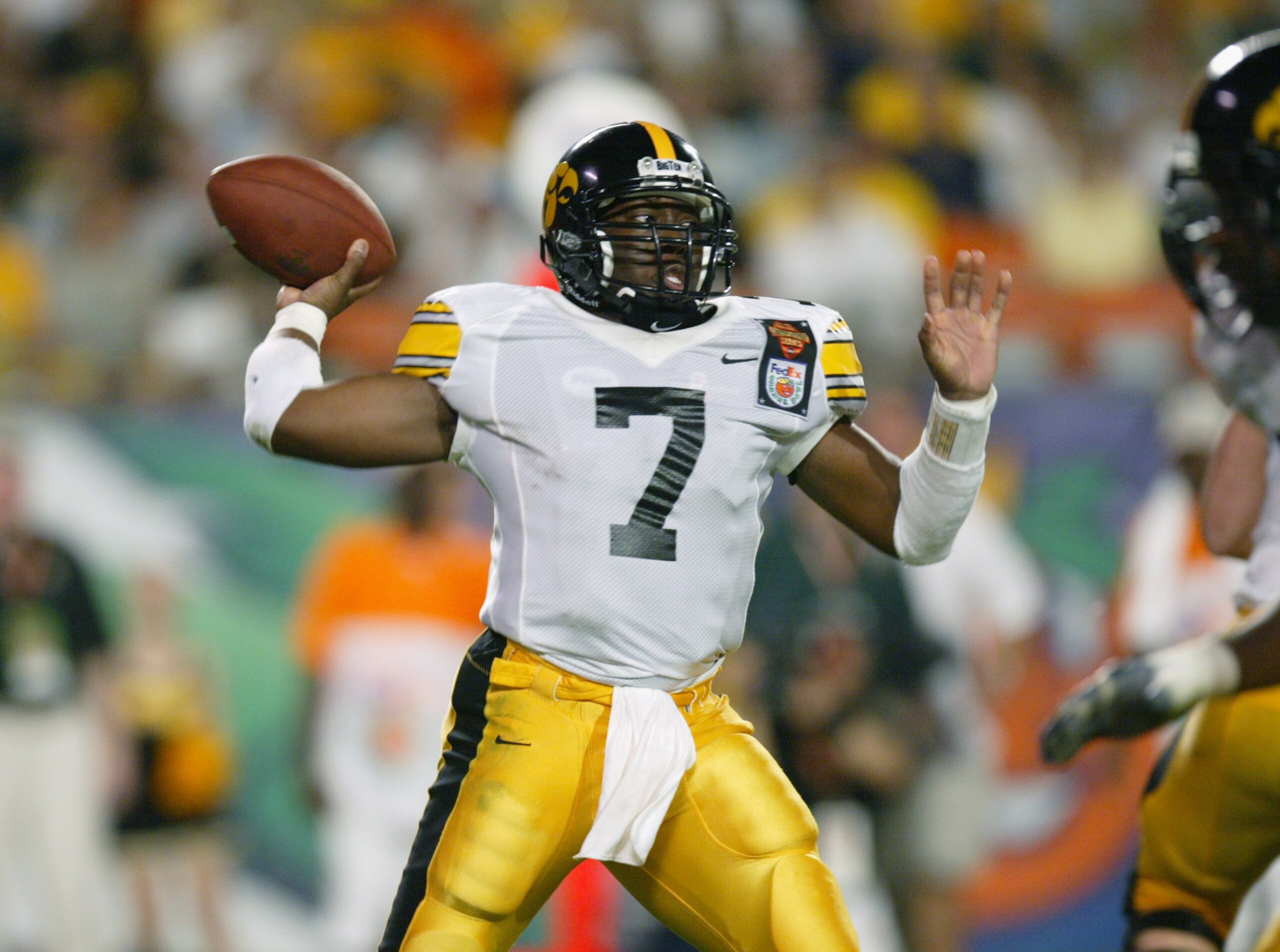 MIAMI - JANUARY 2:  Brad Banks #7 of Iowa passes against USC during the FedEx Orange Bowl on January 2, 2003 at Pro Player Stadium in Miami, Florida.  USC defeated Iowa 38-17.  (Photo by Eliot J. Schechter/Getty Images)
