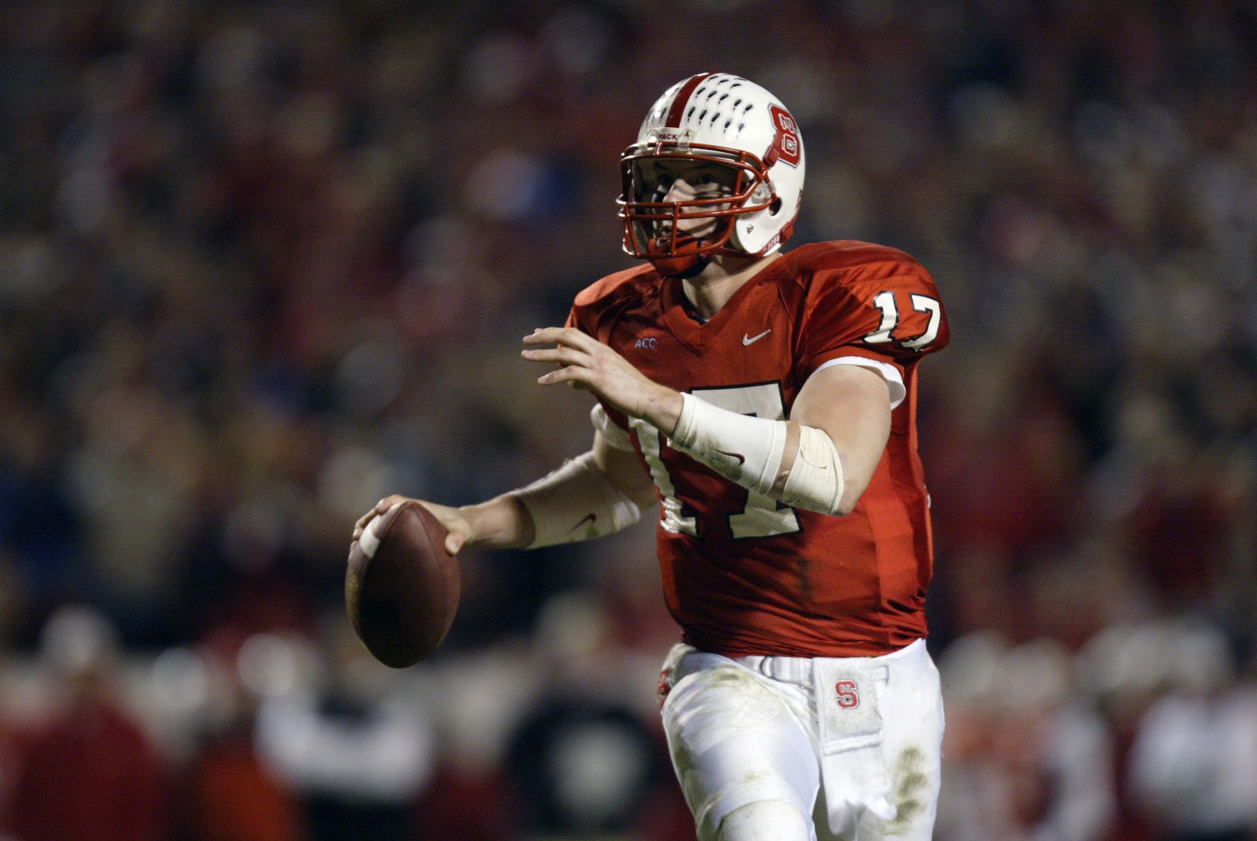 RALEIGH, NC - NOVEMBER 23:  Quarterback Philip Rivers #17 of the North Carolina State University Wolfpack looks to pass during the Atlantic Coast Conference NCAA game against the Florida State University Seminoles at Carter-Finley Stadium on November 23,