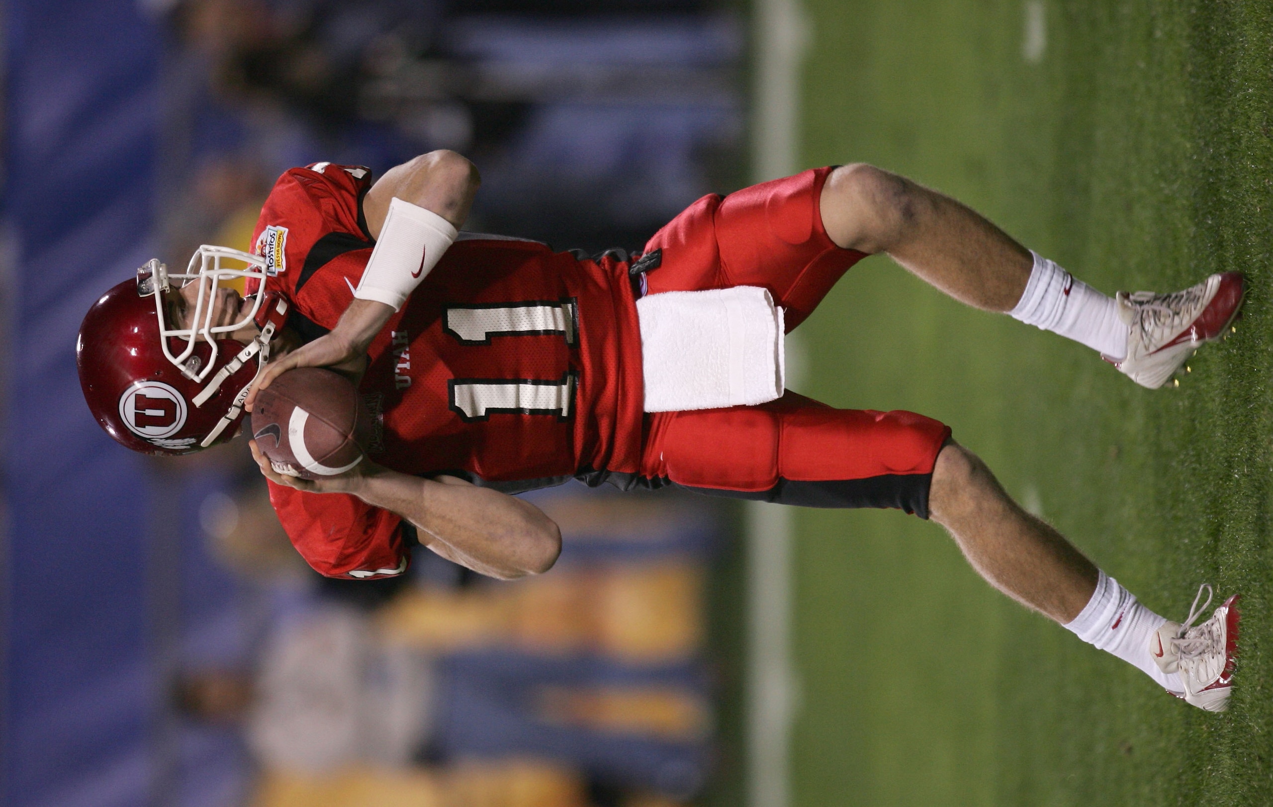 TEMPE, AZ - JANUARY 1:  Quarterback Alex Smith #11 of Utah drops back for a pass against Pittsburgh during the Tostito's Fiesta Bowl at the Sun Devil Stadium on January 1, 2005 in Tempe, Arizona. Utah won the game with the score of 35-7. (Photo by Harry H