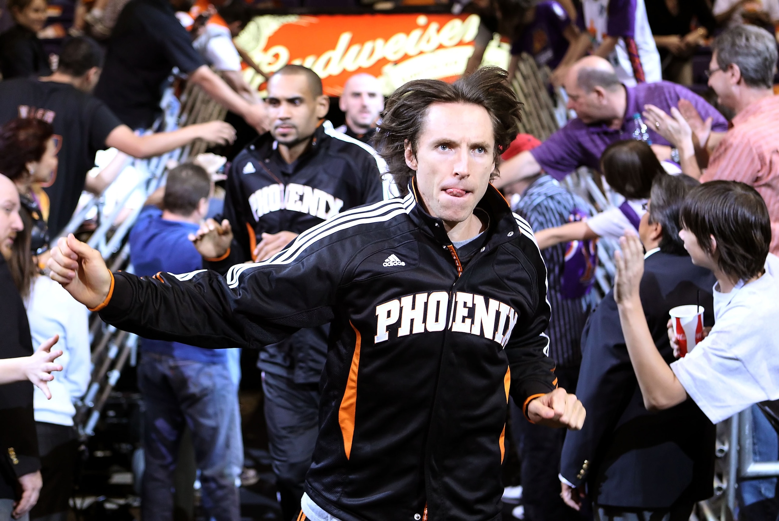 PHOENIX, AZ - APRIL 13:  Steve Nash #13 of the Phoenix Suns runs out onto the court for warm ups to the NBA game against the San Antonio Spurs at US Airways Center on April 13, 2011 in Phoenix, Arizona.  NOTE TO USER: User expressly acknowledges and agree