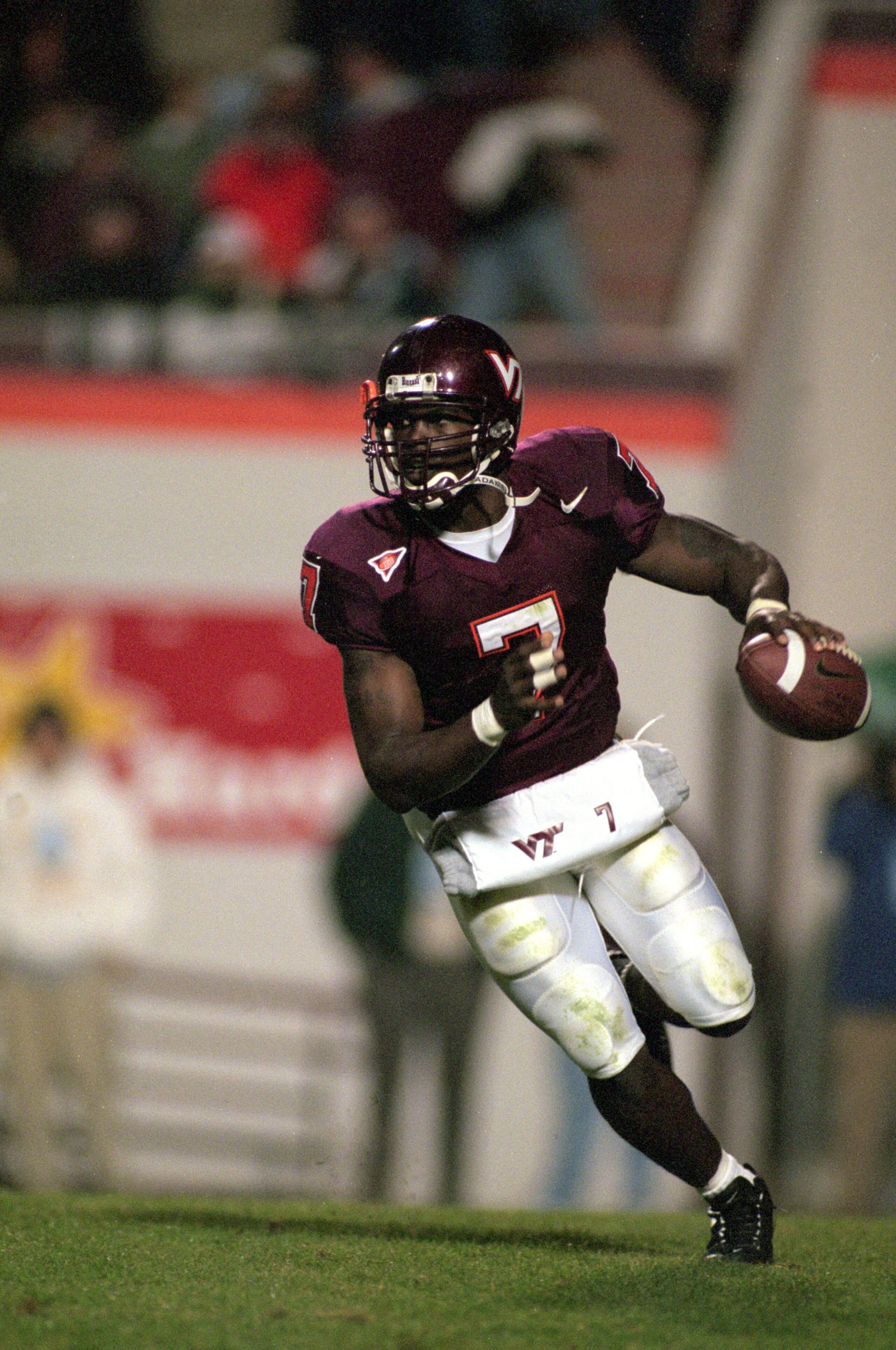 12 Oct 2000:  Michael Vick #7 of the Virginia Tech Hokies moves with the ball during the game against the West Virginia Volunteers in Blacksburg, Virginia. The Hokies defeated the Volunteers 48-20.Mandatory Credit: Scott Halleran  /Allsport