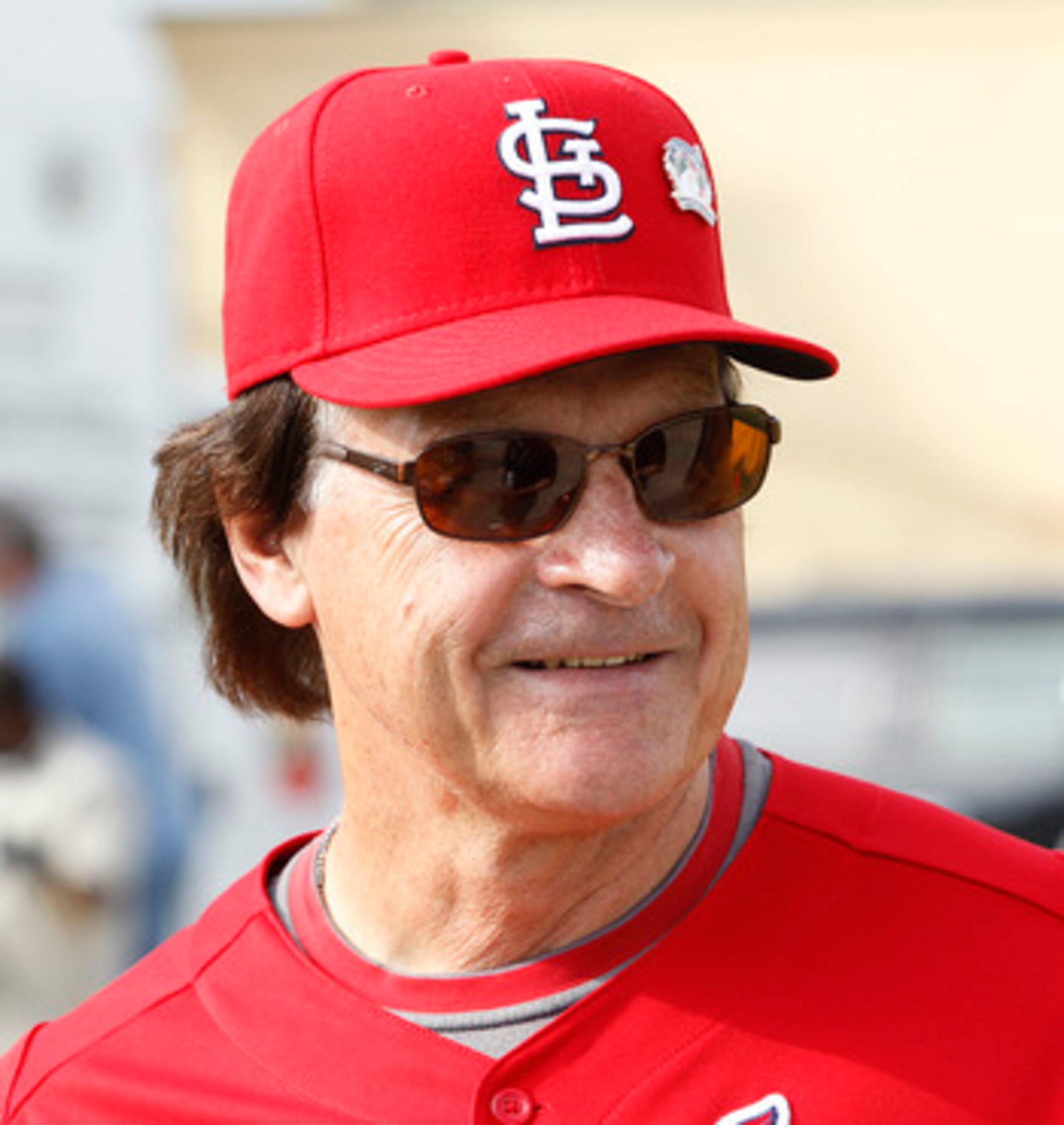JUPITER, FL - FEBRUARY 17: Manager Tony La Russa #10 of the St. Louis Cardinals talks to a member of the media outside the clubhouse at Roger Dean Stadium on February 17, 2011 in Jupiter, Florida. (Photo by Joel Auerbach/Getty Images)