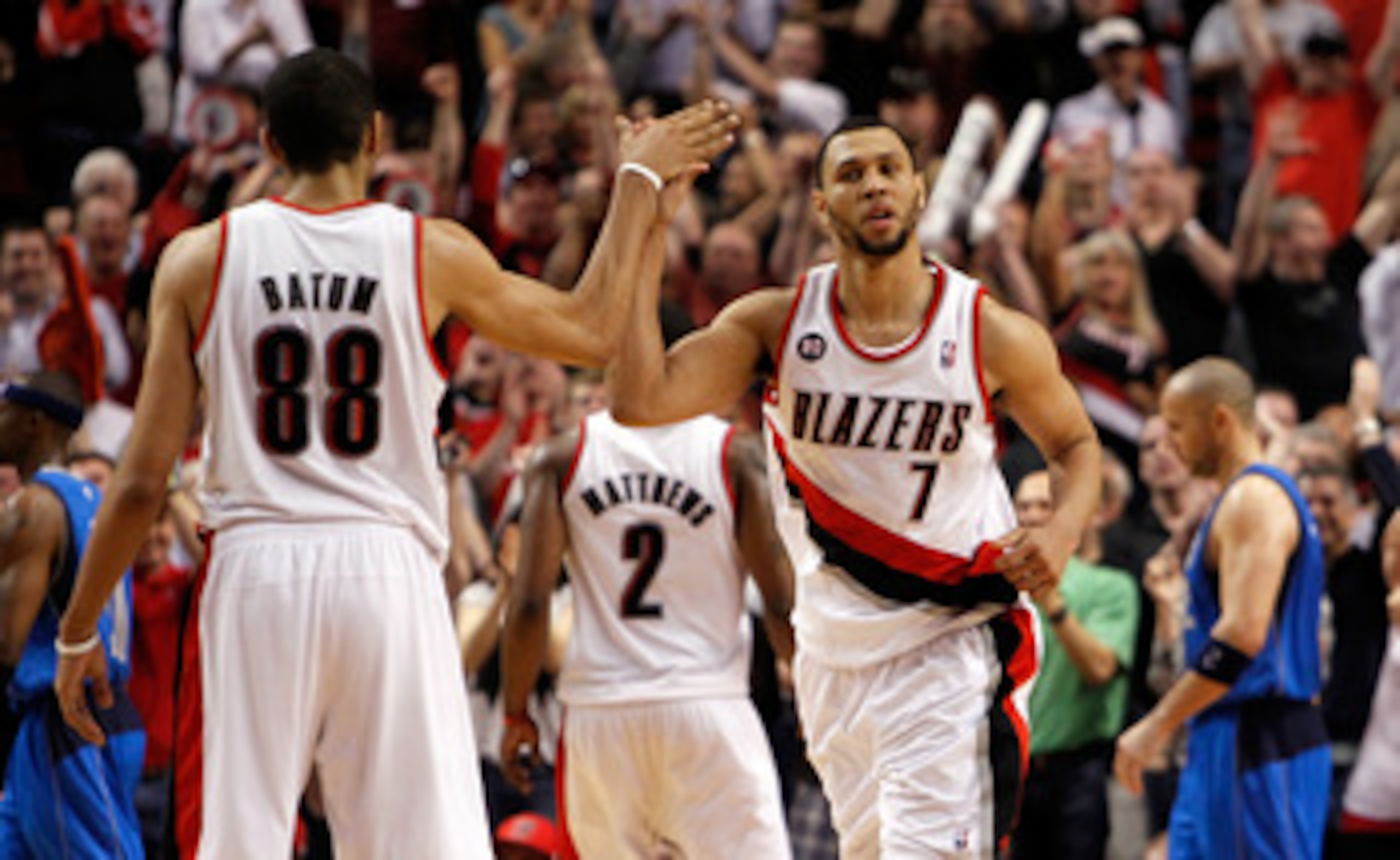 PORTLAND, OR - APRIL 23:  Brandon Roy #7 high fives Nicolas Batum #88 of the Portland Trail Blazers against the Dallas Mavericks in Game Four of the Western Conference Quarterfinals in the 2011 NBA Playoffs on April 23, 2011 at the Rose Garden in Portland