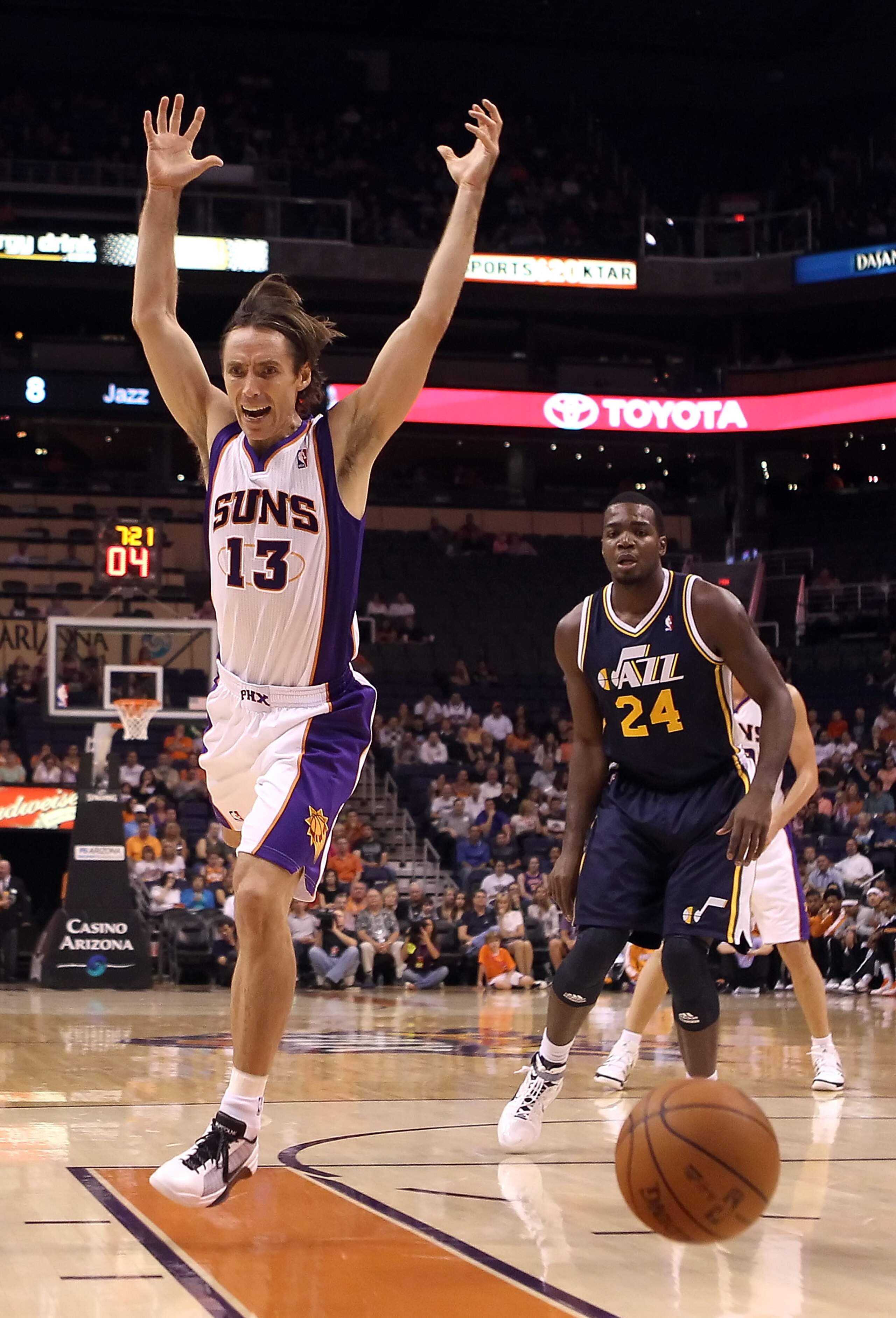 PHOENIX - OCTOBER 12:  Steve Nash #13 of the Phoenix Suns looses the ball as he drives to the basket past Paul Millsap #24 of the Utah Jazz during the preseason NBA game at US Airways Center on October 12, 2010 in Phoenix, Arizona. NOTE TO USER: User expr