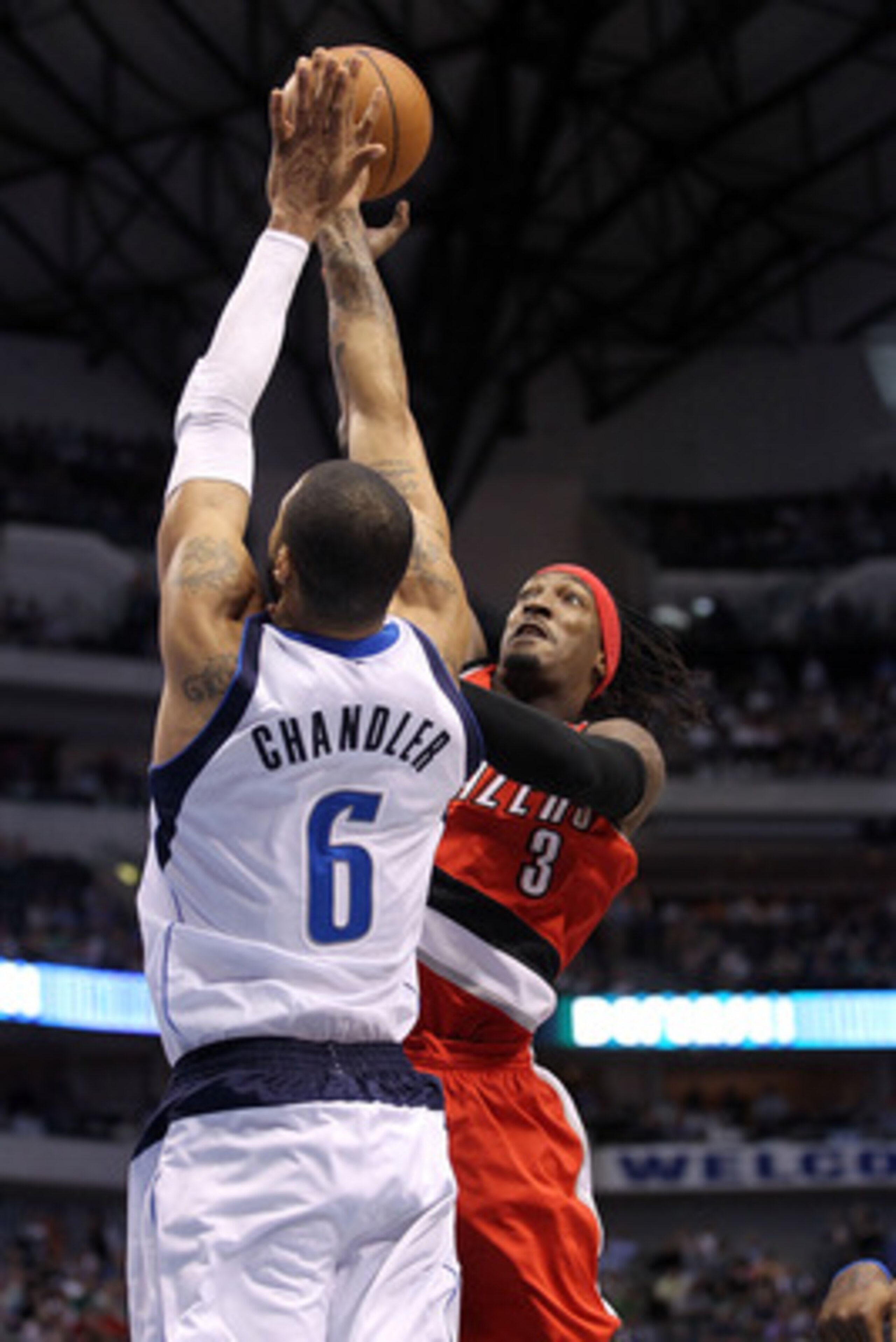 DALLAS, TX - APRIL 19:  Forward Gerald Wallace #3 of the Portland Trail Blazers takes a shot against Tyson Chandler #6 of the Dallas Mavericks in Game Two of the Western Conference Quarterfinals during the 2011 NBA Playoffs on April 19, 2011 at American A