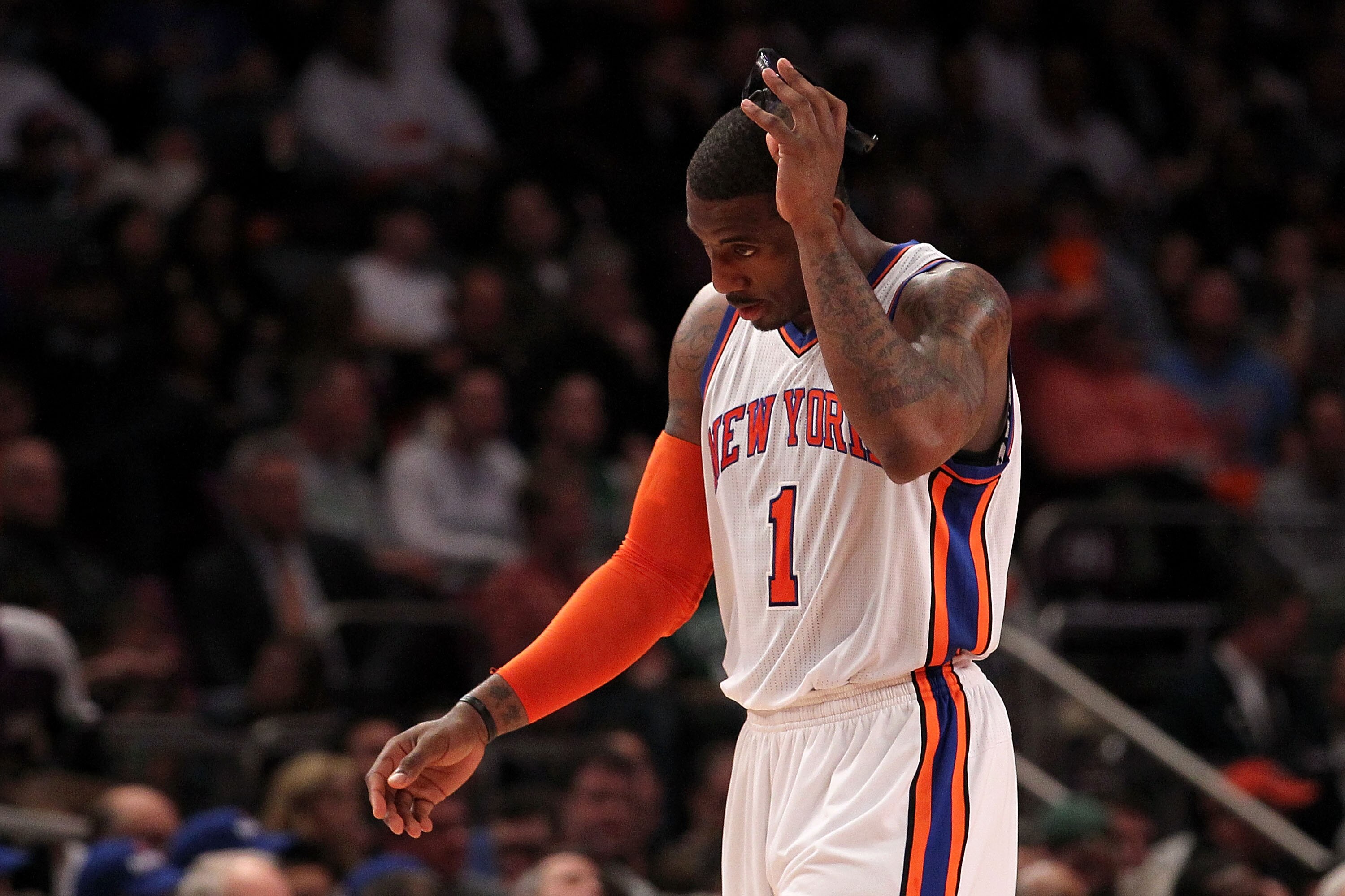 NEW YORK, NY - APRIL 22:  Amar'e Stoudemire #1 of the New York Knicks walks towards the bench with his head down against the Boston Celtics in Game Three of the Eastern Conference Quarterfinals in the 2011 NBA Playoffs on April 22, 2011 at Madison Square