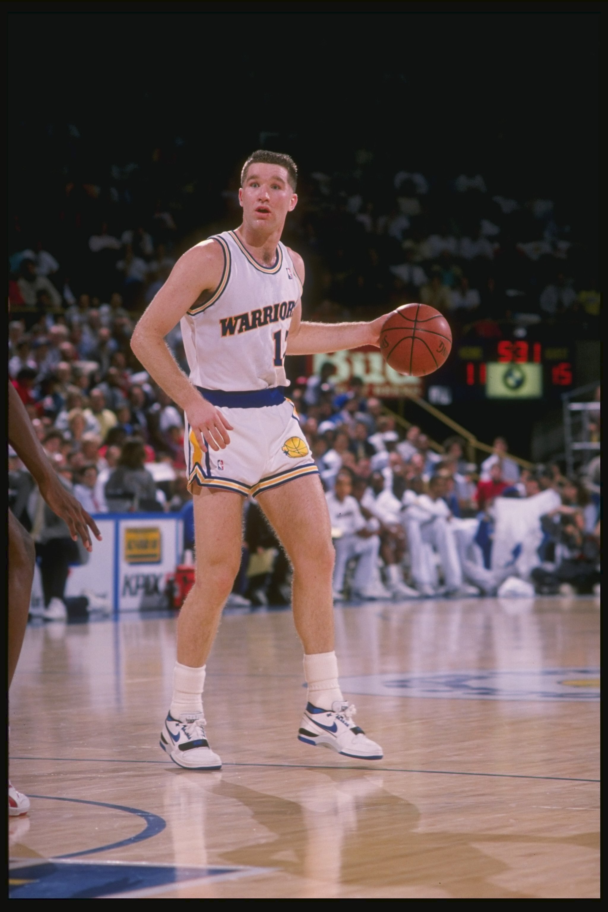 1988:  Forward Chris Mullin of the Golden State Warriors dribbles the ball down the court during a game at the Oakland Coliseum Arena in Oakland, California. Mandatory Credit: Otto Greule  /Allsport