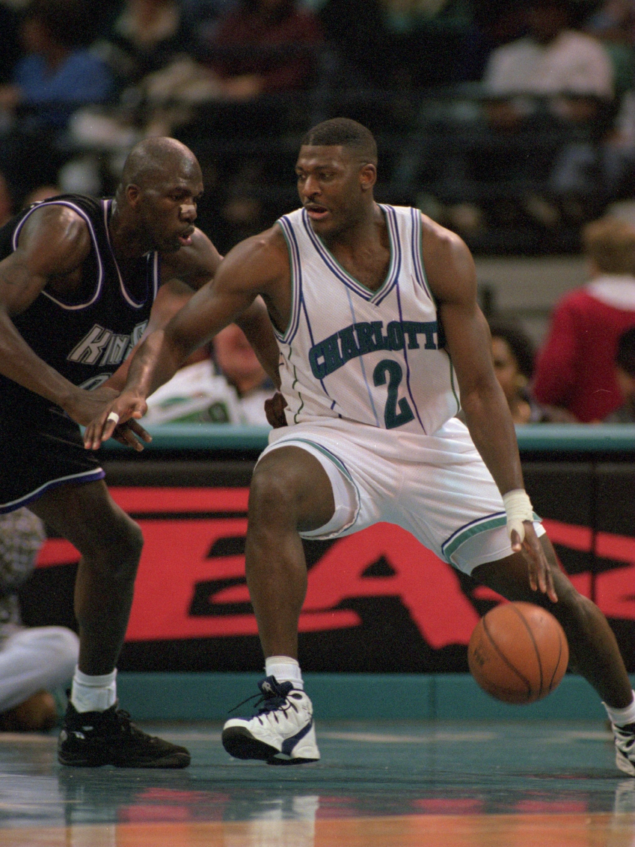 8 Feb 1996:  Forward Larry Johnson #2 of the Charlotte Hornets attempts to dribble drive around a defender from the Sacramento Kings during the Hornet''s 115-105 victory over the Kings at the Charlotte Coliseum in Charlotte, North Carolina.   Mandatory Cr