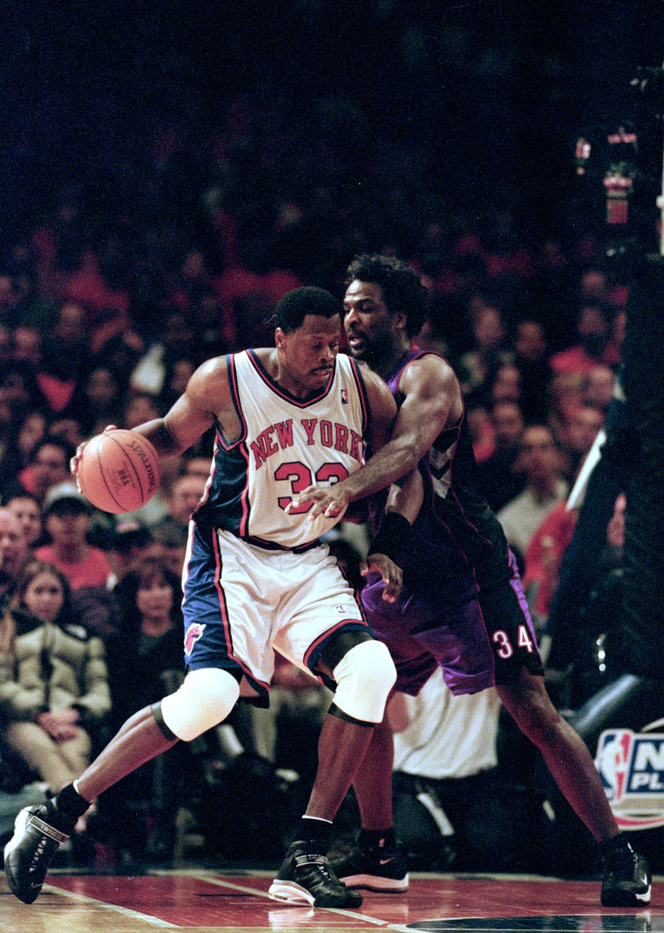 23 Apr 2000: Patrick Ewing #33 of the  New York Knicks dribbles the ball to the basket as he is blocked by Charles Oakley #34 of the Toronto Raptors during round one of the NBA Playoffs at the Madison Square Garden in New York. The Knicks defeated the Rap