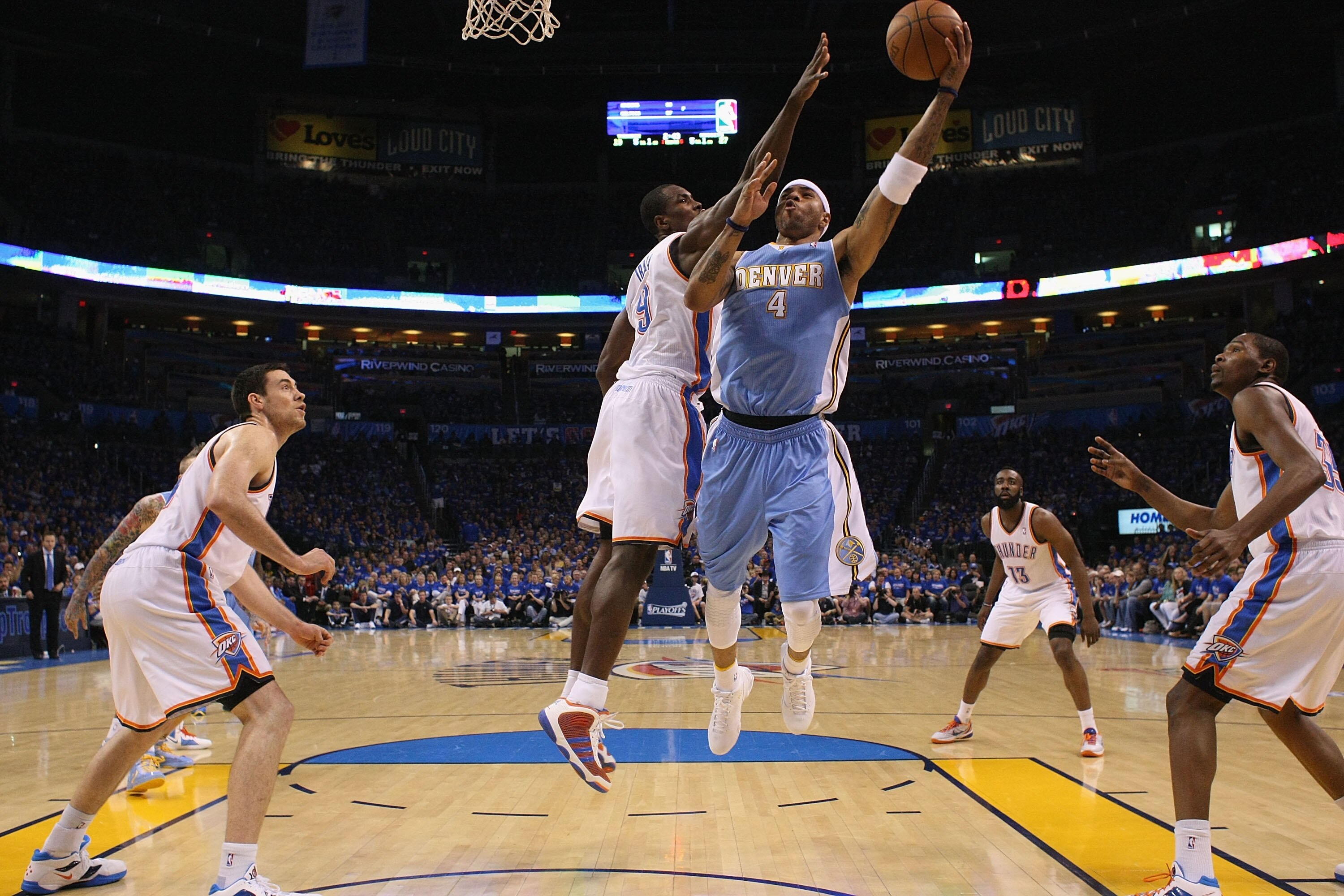 OKLAHOMA CITY, OK - APRIL 17:  Kenyon Martin #4 of the Denver Nuggets drives to the basket against Serge Ibaka #9 of the Oklahoma City Thunder in Game One of the Western Conference Quarterfinals in the 2011 NBA Playoffs on April 17, 2011 at the Ford Cente