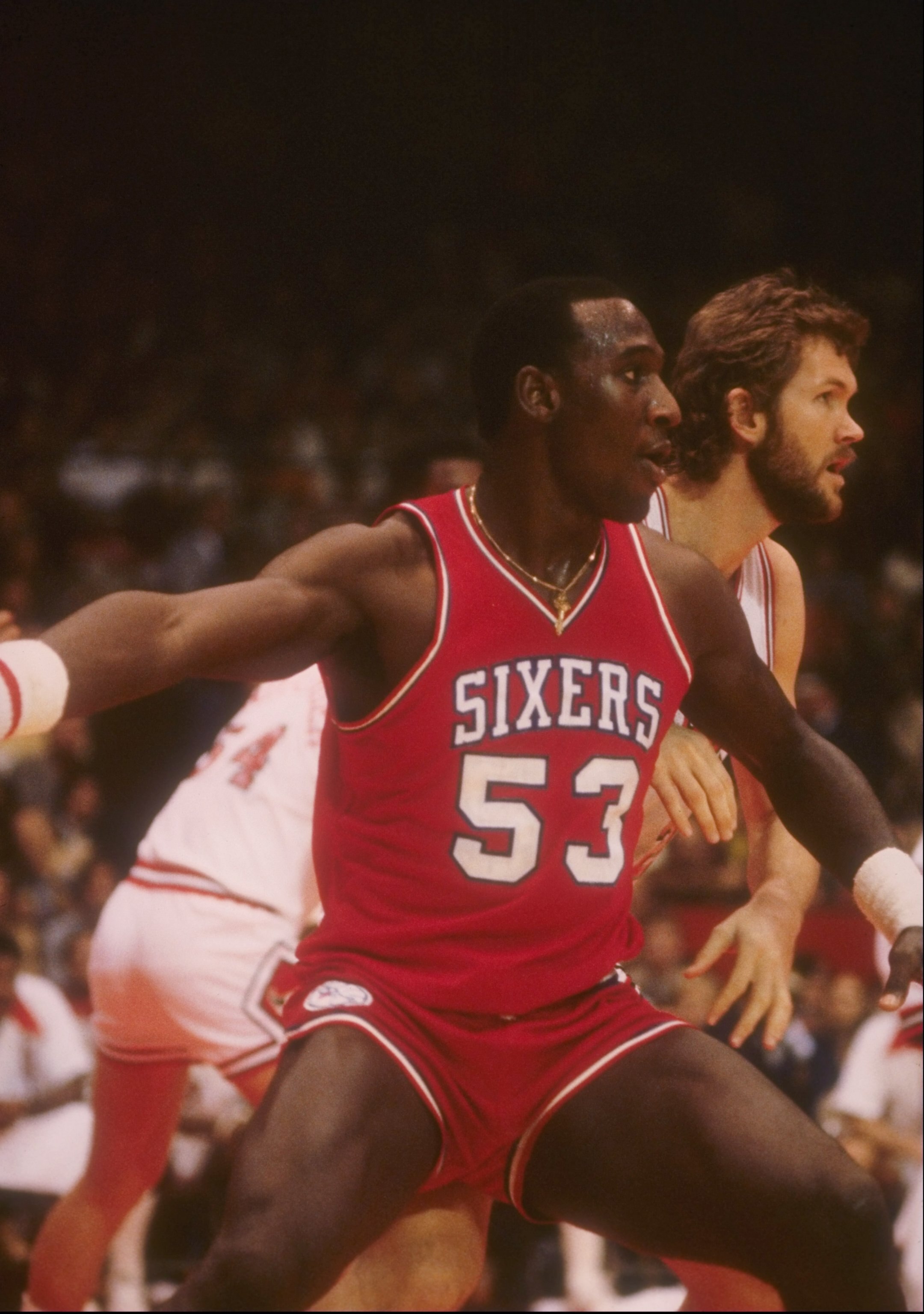Darryl Dawkins of the Philadelphia 76ers looks on during a game.