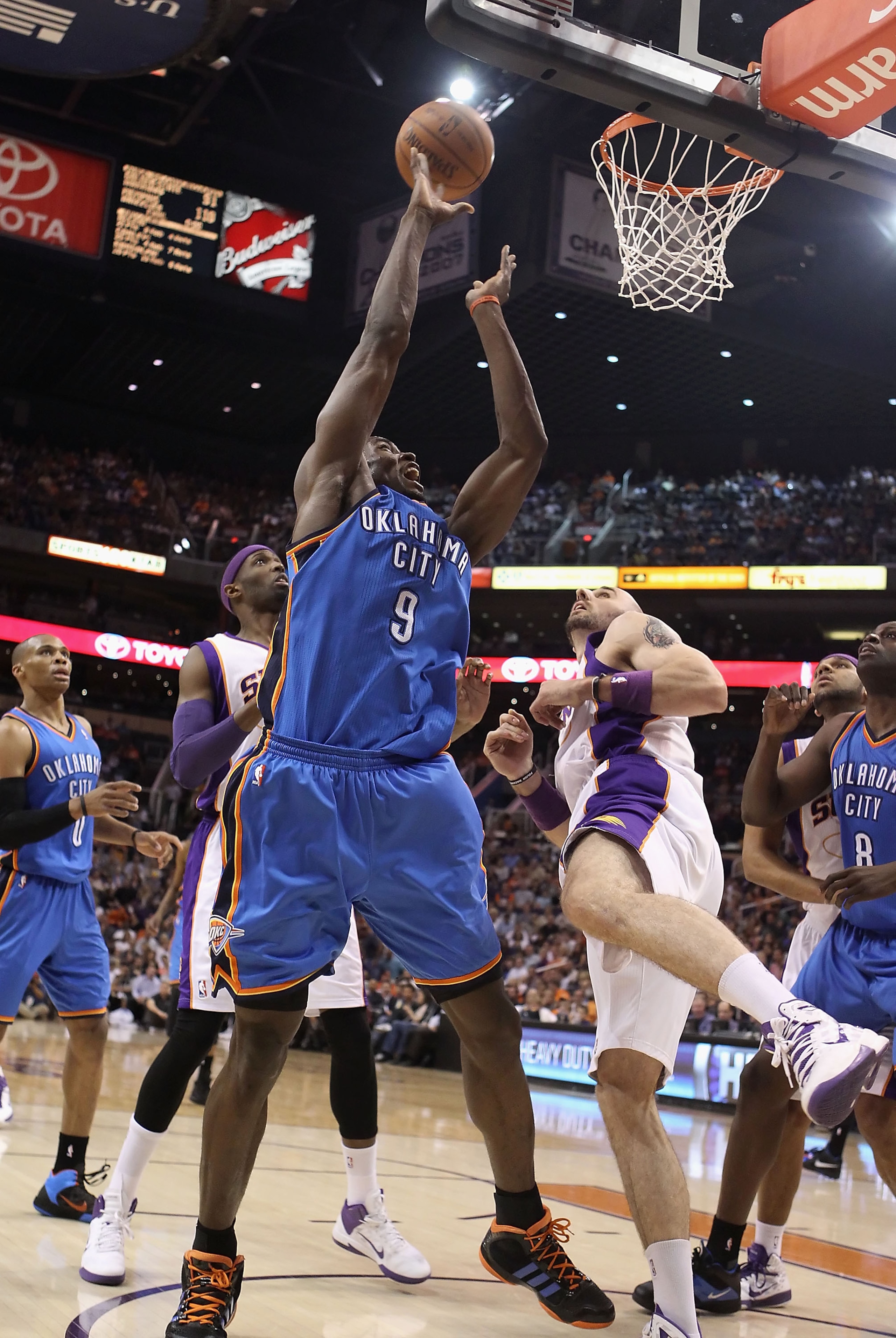 PHOENIX, AZ - MARCH 30:  Serge Ibaka #9 of the Oklahoma City Thunder puts up a shot during the NBA game against the Phoenix Suns at US Airways Center on March 30, 2011 in Phoenix, Arizona. The Thunder defeated the Suns 116-98.   NOTE TO USER: User express