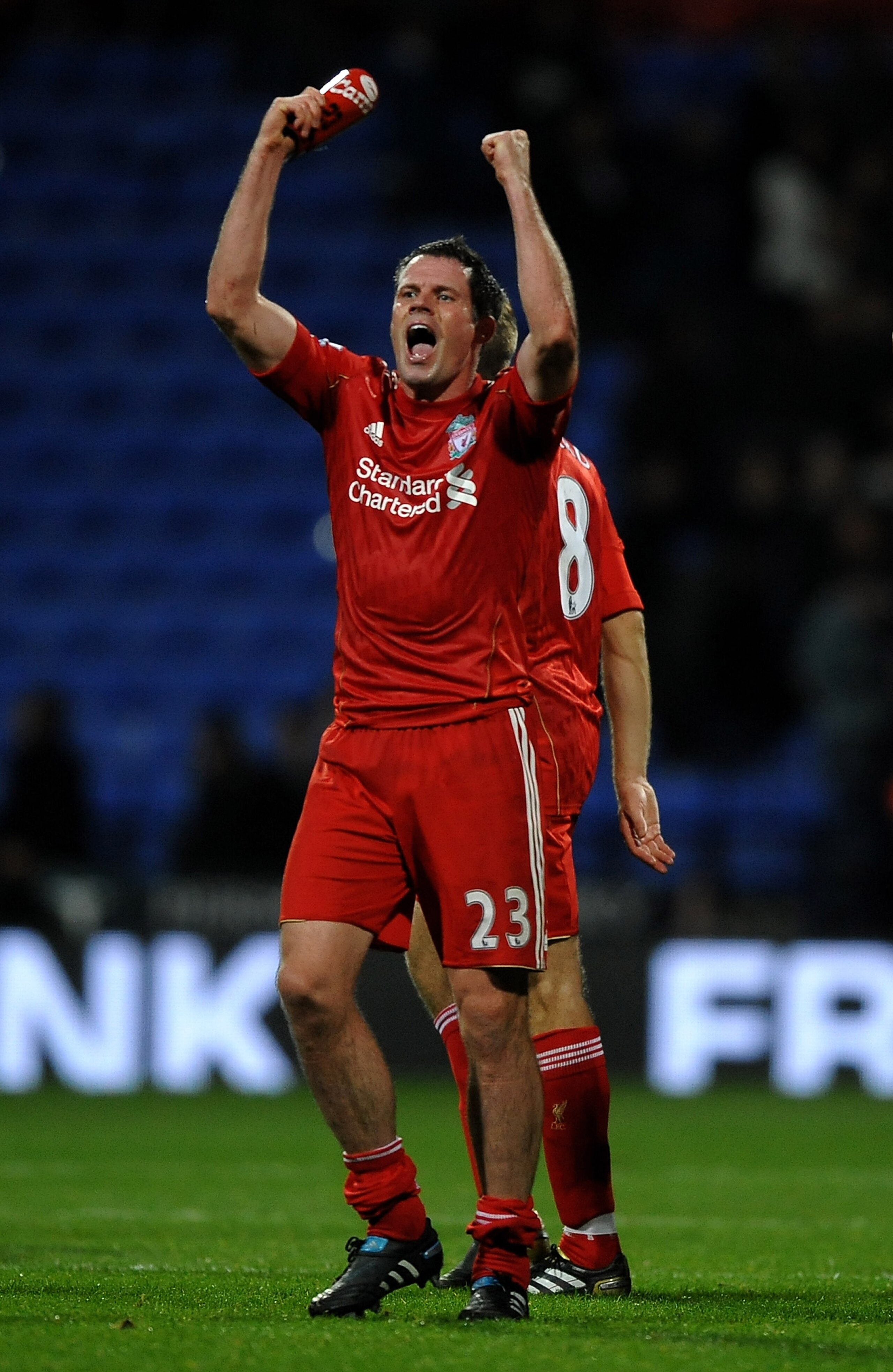 BOLTON, ENGLAND - OCTOBER 31:   Jamie Carragher of Liverpool celebrates victory at the end of the Barclays Premier League match between Bolton Wanderers and Liverpool at the Reebok Stadium on October 31, 2010 in Bolton, England. (Photo by Laurence Griffit