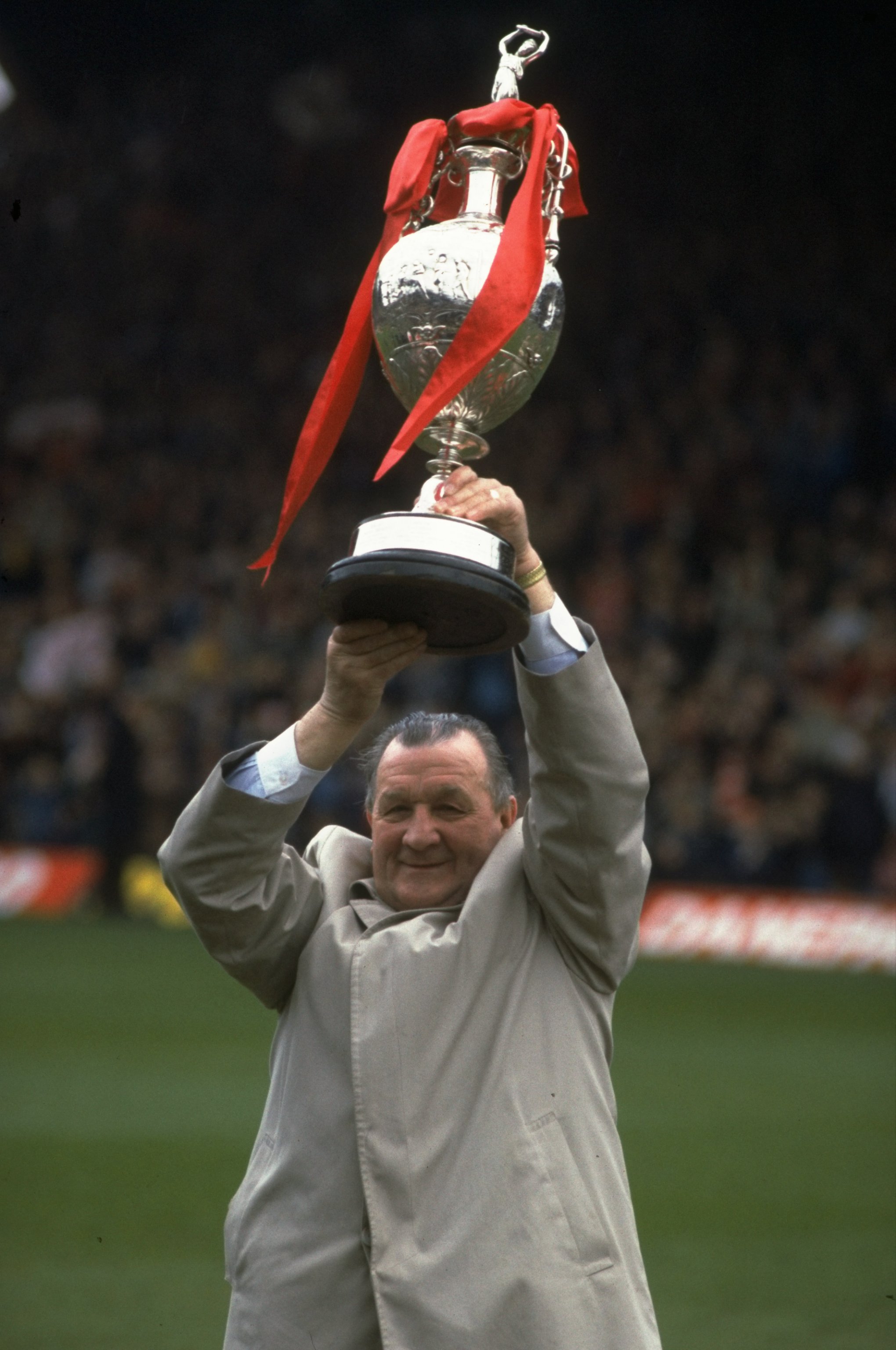1983:  Bob Paisley Manager of Liverpool holds aloft the League Championship trophy after the final League game at Anfield in Liverpool, England. \ Mandatory Credit: Mike  Powell/Allsport