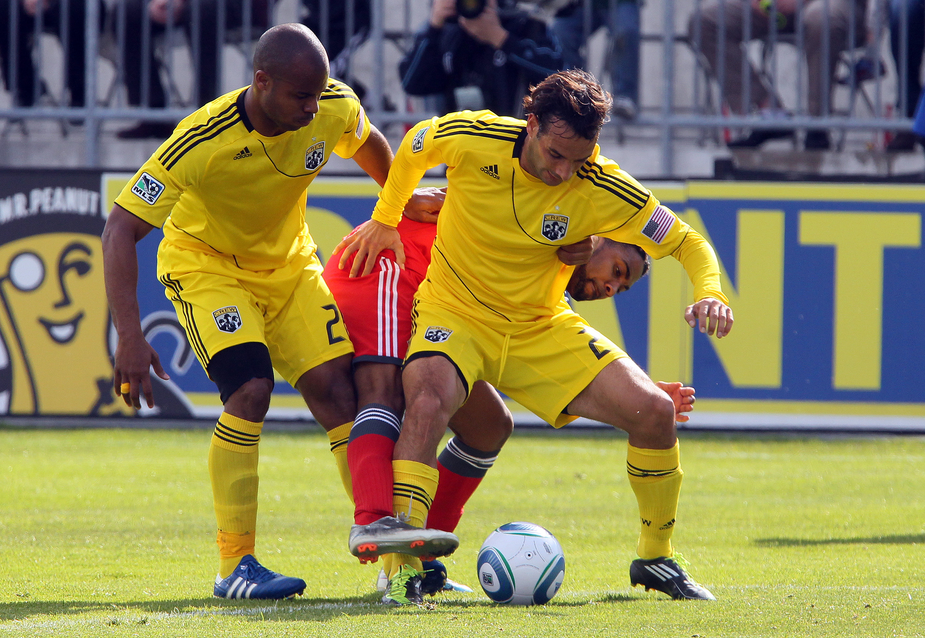 TORONTO, CANADA - APRIL 23: Javier Martina #33 of Toronto FC crashes into Sebastian Miranda #21 and Julius James #26 of Columbus Crew during MLS action at BMO Field April 23, 2011 in Toronto, Ontario, Canada. (Photo by Abelimages/Getty Images)