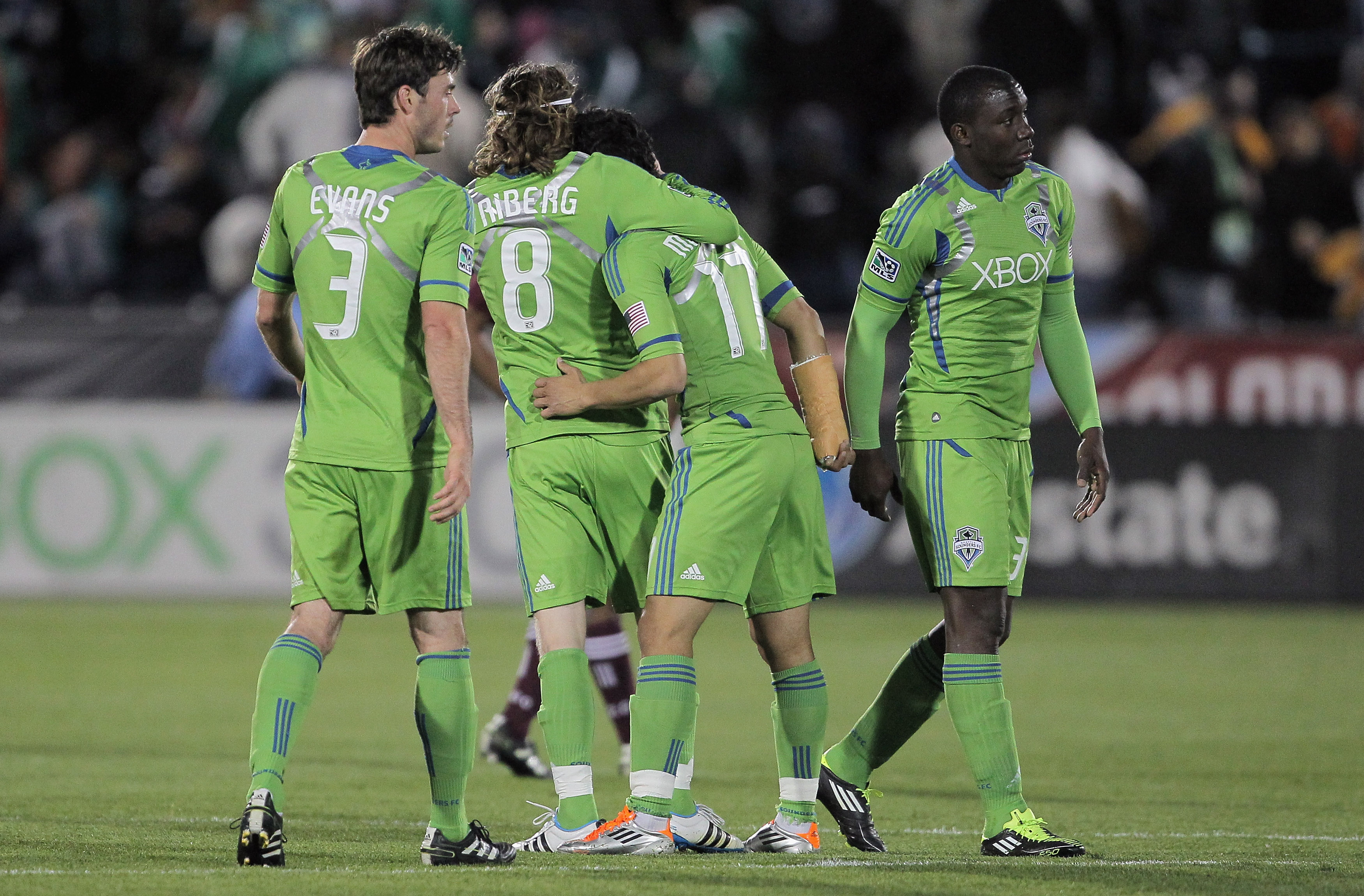 COMMERCE CITY, CO - APRIL 22: Brad Evans #3, Erik Friberg #8, Steve Zakuani #11 and O'Brian White #13 of the Seattle Sounders FC celebrate their win over the Colorado Rapids at Dick's Sporting Goods Park on April 22, 2011 in Commerce City, Colorado. (Ph