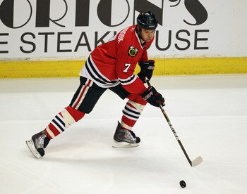 CHICAGO, IL - APRIL 17: Brent Seabrook #7 of the Chicago Blackhawks controls the puck against the Vancouver Canucks in Game Three of the Western Conference Quarterfinals during the 2011 NHL Stanley Cup Playoffs at the United Center on April 17, 2011 in Ch