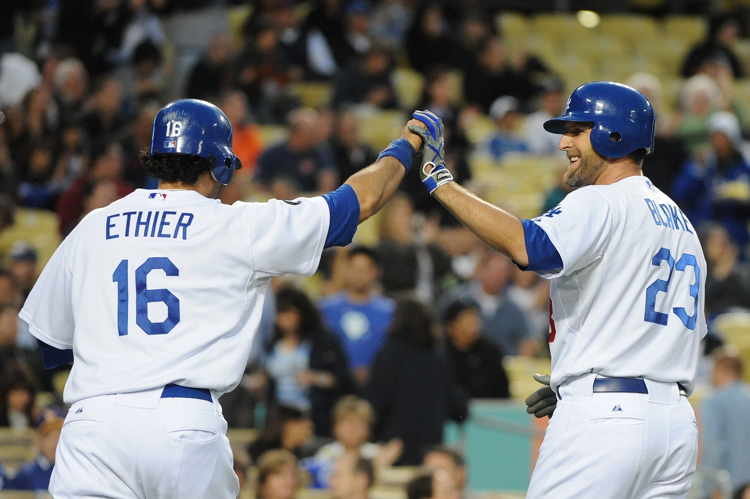 LOS ANGELES, CA - APRIL 20:  (L-R) Andre Ethier #16 celebrates with teammate Casey Blake #23 of the Los Angeles Dodgers after hitting a two run homerun in the first inning against the Atlanta Braves at Dodger Stadium on April 20, 2011 in Los Angeles, Cali