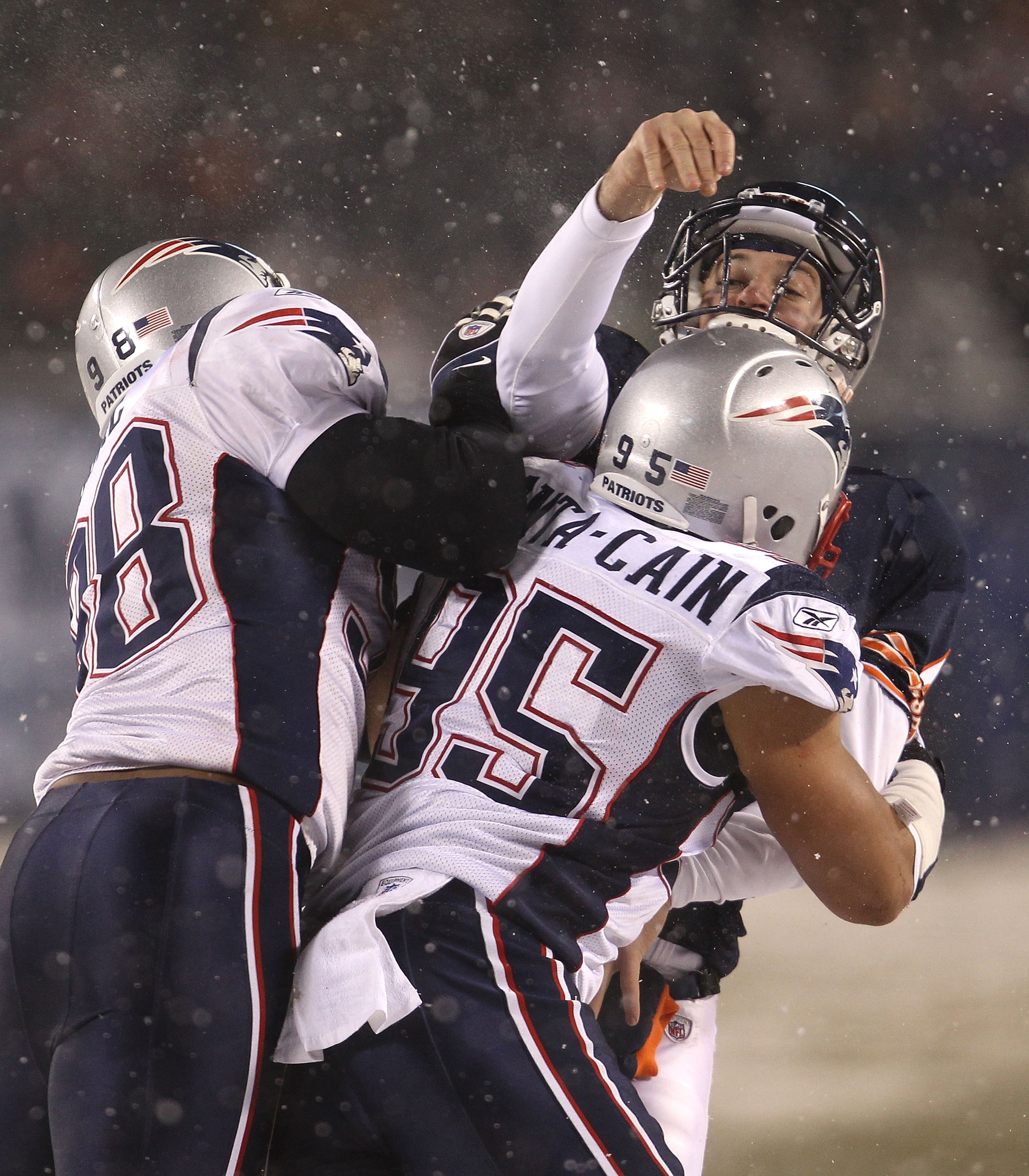 CHICAGO - DECEMBER 12: Jay Cutler #6 of the Chicago Bears is hit after a throw by Eric Moore #98 and Tully Banta-Cain #95 of the New England Patriots at Soldier Field on December 12, 2010 in Chicago, Illinois. The Patriots defeated the Bears 36-7. (Photo
