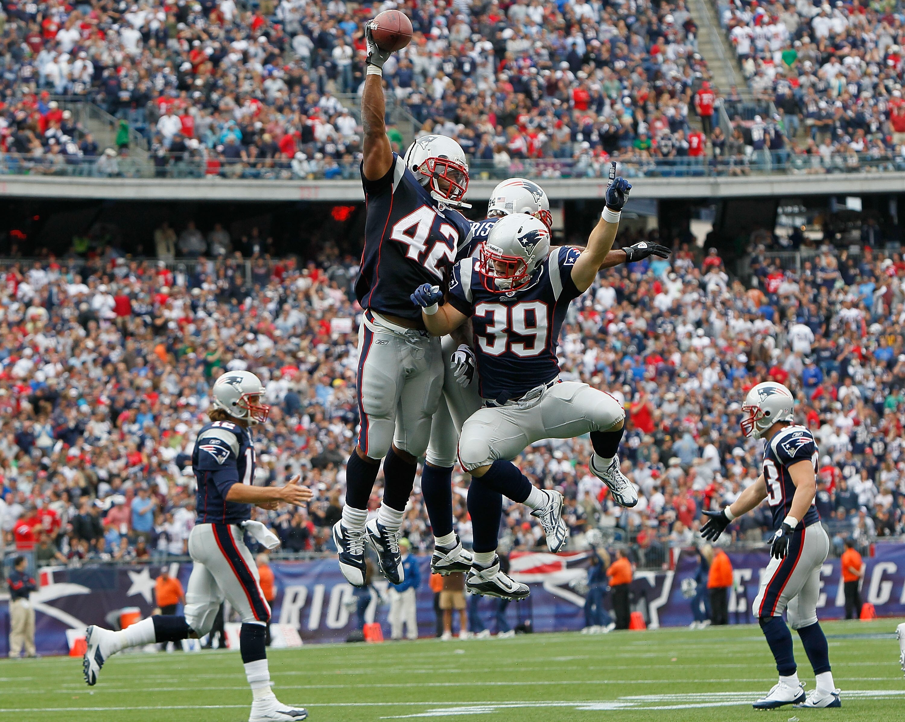 FOXBORO, MA - SEPTEMBER 26: BenJarvus Green-Elllis #42 of the New England Patriots celebrates his touchdown with teammates Sammy Morris #34 and Danny Woodhead #39 in the second half against the Buffalo Bills at Gillette Stadium in the second half on Septe
