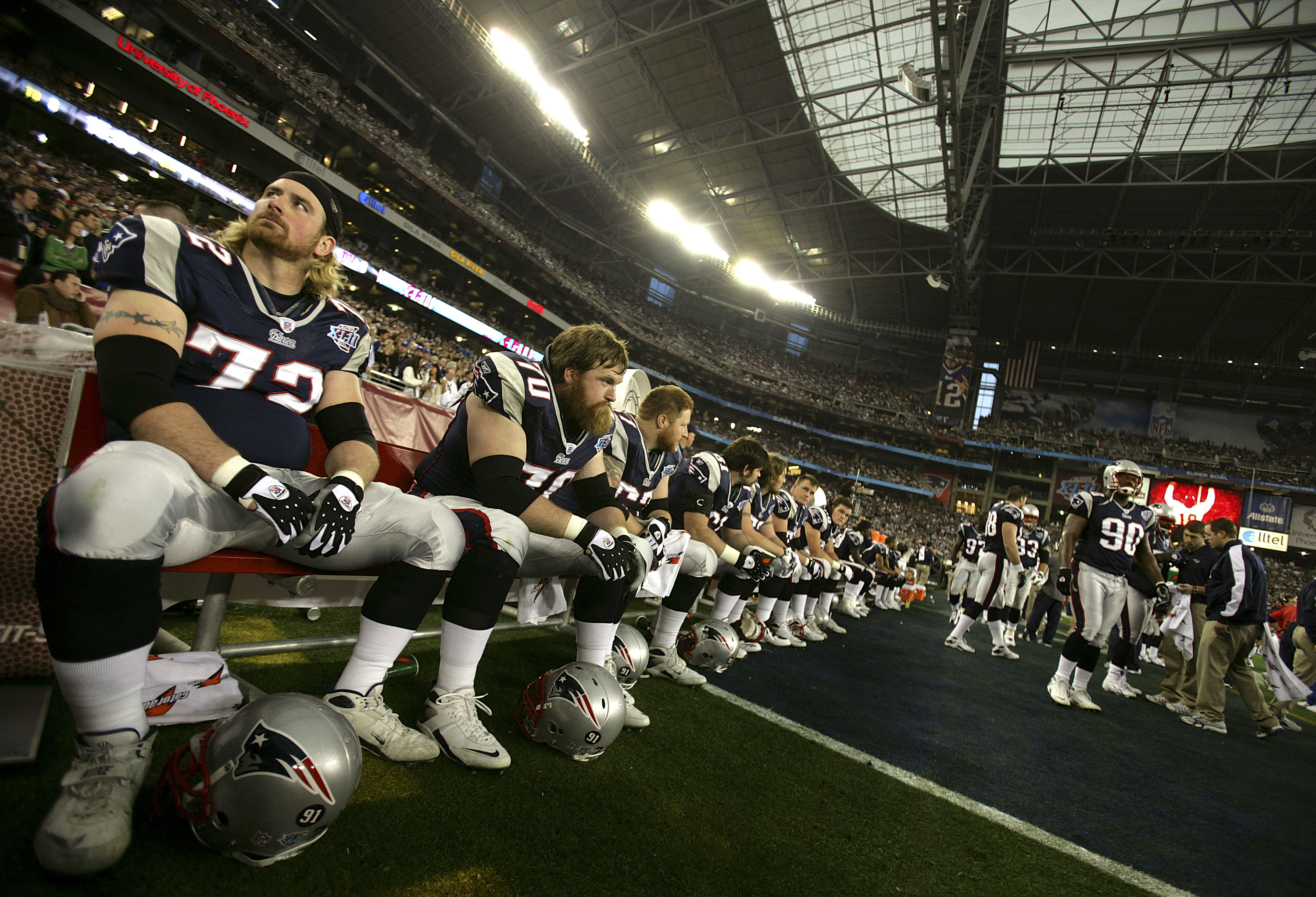 GLENDALE, AZ - FEBRUARY 03:  Matt Light #72 (L) and Logan Mankins #70 of the New England Patriots wait on the bench minutes before kick-off against the New York Giants in Super Bowl XLII on February 3, 2008 at the University of Phoenix Stadium in Glendale