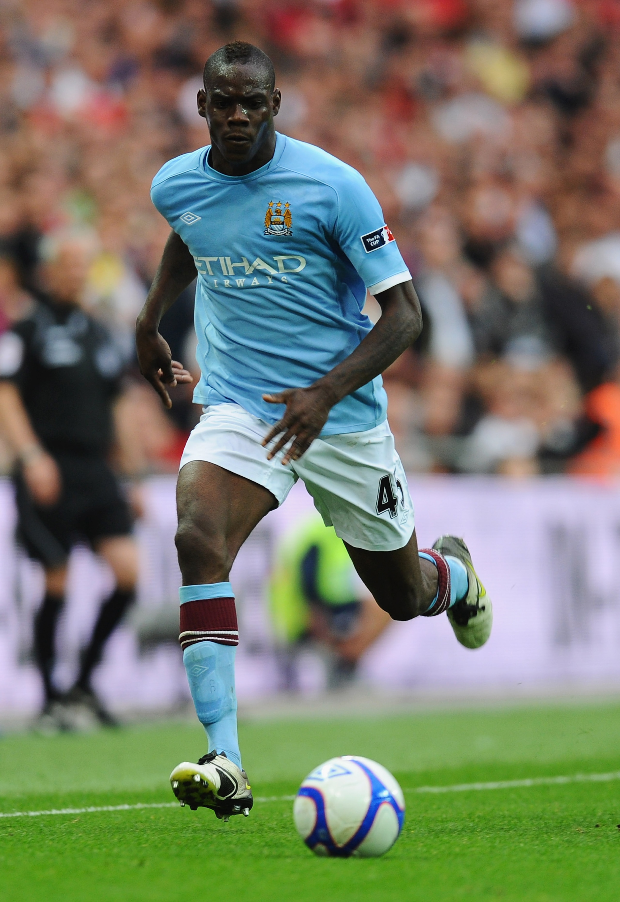 LONDON, ENGLAND - APRIL 16:  Mario Balotelli of Manchester City in action during the FA Cup sponsored by E.ON semi final match between Manchester City and Manchester United at Wembley Stadium on April 16, 2011 in London, England.  (Photo by Mike Hewitt/Ge