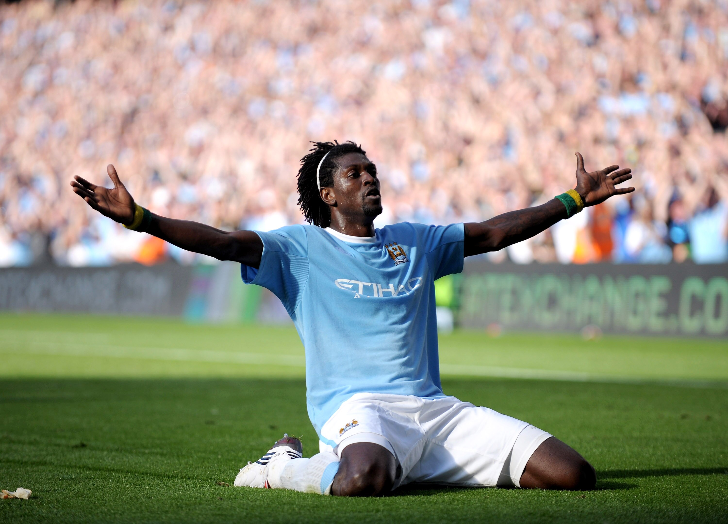 MANCHESTER, ENGLAND - SEPTEMBER 12:  Emmanuel Adebayor of Manchester City celebrates in front of the Arsenal fans after scoring during the Barclays Premier League match between Manchester City and Arsenal at the City of Manchester Stadium on September 12,