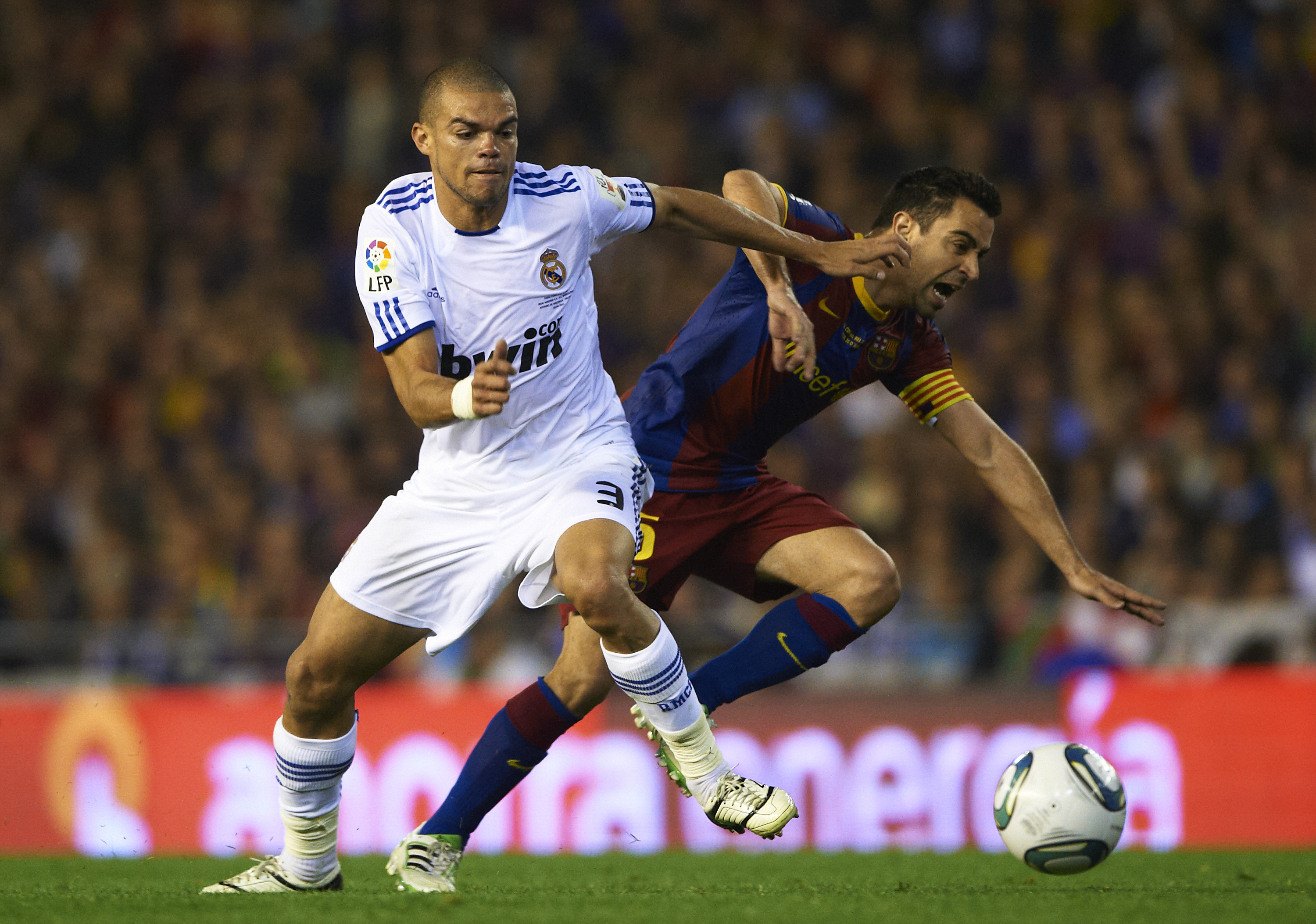 VALENCIA, BARCELONA - APRIL 20: Xavi Hernandez (r) of Barcelona and Pepe of Real Madrid competes for the ball during the Copa del Rey final match between Real Madrid and Barcelona at Estadio Mestalla on April 20, 2011 in Valencia, Spain.  (Photo by Manuel